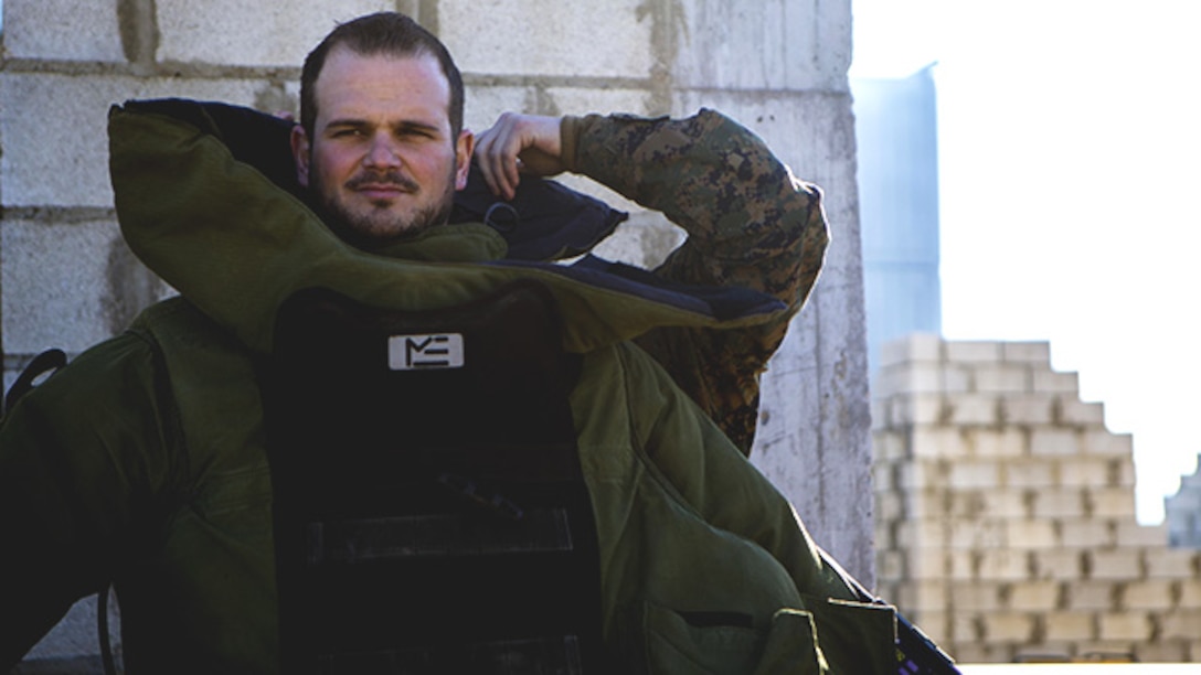 Spanish Defense Force Cabo Primero Antonio Diosdade, a noncommissioned officer with Unidad Militar de Emergencias, an emergency response force, puts on a bomb suit at Morón Air Base, Spain, Feb. 18, 2015. Explosive ordnance disposal Marines with Special-Purpose Marine Air-Ground Task Force Crisis Response-Africa, which is based out of Morón, demonstrate the different capabilities of their equipment to further develop the two units’ relationship for future NATO training events. (U.S. Marine Corps photograph by Lance Cpl. Christopher Mendoza/Released)