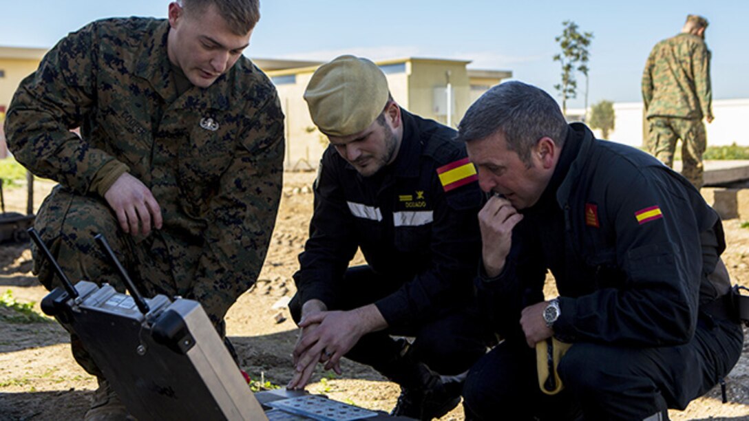 U.S. Marine Corps Staff Sgt. Andrew Cooper, an explosive ordnance disposal technician with Special-Purpose Marine Air-Ground Task Force Crisis Response-Africa, demonstrates the capabilities of a remote controlled robot used by EOD Marines to the Spanish Defense Force’s Unidad Militar de Emergencias, an emergency response force, at Morón Air Base, Spain, Feb. 18, 2015. The Marines used the demonstration as an opportunity to build a stronger relationship with UME personnel and set the stage for future joint training exercises. (U.S. Marine Corps photograph by Lance Cpl. Christopher Mendoza/Released)