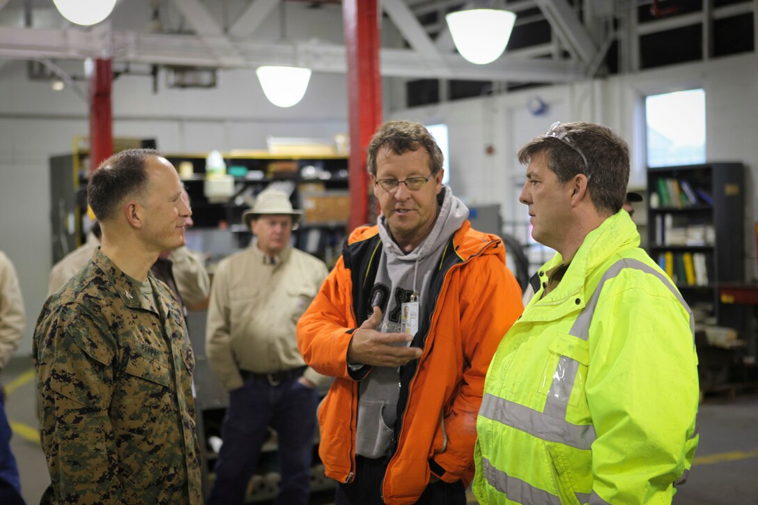 U.S. Marine Corps Col. Chris Pappas III Commanding Officer Marine Corps Air Station Cherry Point talks to civilian Eddy Posta (center) and Robert Grassman (right) MCAS Cherry Point, N.C., Jan. 14, 2015. After the introduction to the Voluntary Protection Program (VPP) Col. Pappas discusses the program with the workers. VPP, facilitate change in safety culture. The goal is to create a proactive work environment to reduce mishaps and preserve limited resources, both personnel and property.
(U.S. Marine Corps photo by Lance Cpl Colin Broadstone/ Released)
