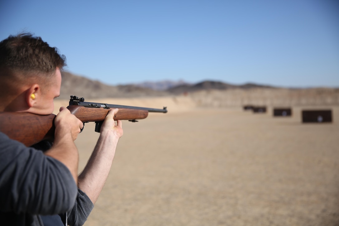 Cpl. James Marker, Marksmanship Training Unit Shooting Team, native of Wild Rose, Wis., shoots a Harrington and Richardson .22 caliber rifle during the 3rd annual Smallbore and Air Rifle Competition at Range 3 A, Feb. 21, 2015. The targets were spaced out at the 40, 60, 77 and 100 yards.