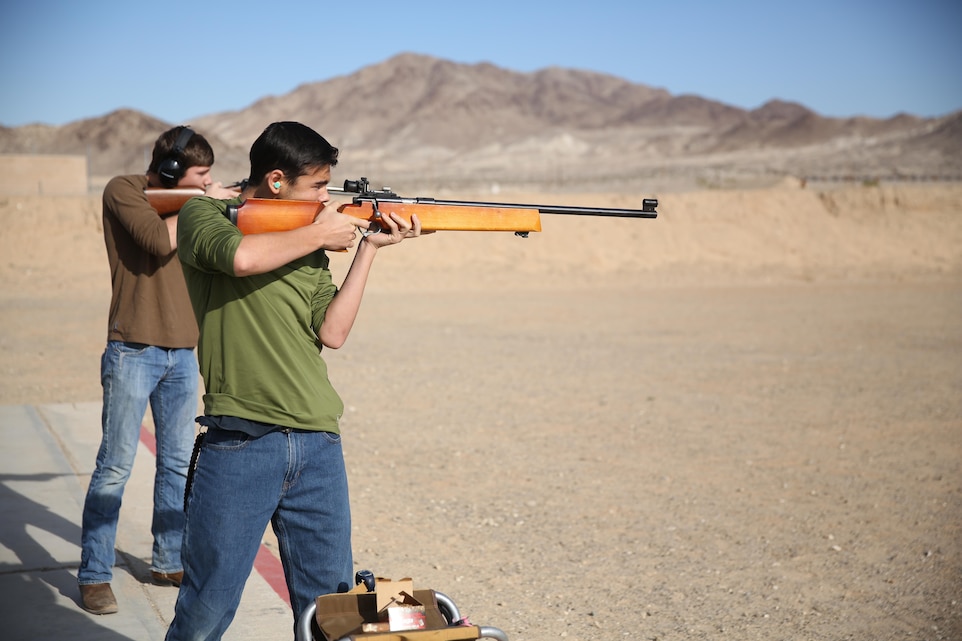 Adam Pereira, son of Ret. Gunnery Sgt. Jose Pereira, shoots an Olympic style .22 caliber rifle during the 3rd annual Smallbore and Air Rifle Competition at Range 3 A, Feb. 21, 2015. The event provided two separate ranges for smallbore and air rifles.