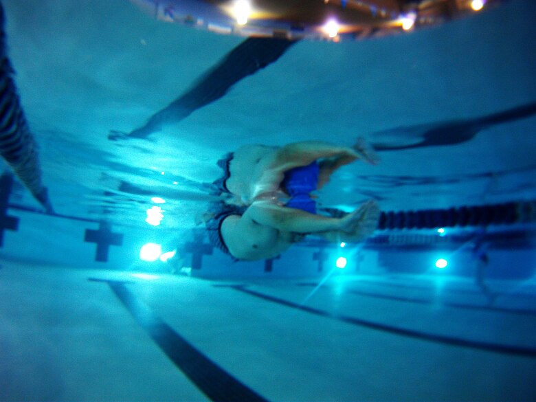 A participant in the 2015 U.S. Air Force Trials practices pushing off the wall during a swimming practice session at Nellis Air Force Base, Nev., Feb. 27, 2015. Fitness and teamwork are a way of life in the military. Serious illness and injury can have a profound impact on that way of life. The Air Force Trials encourages recovering warriors to make adaptive sports a part of their recovery. (U.S. Air Force photo by Senior Airman Thomas Spangler)