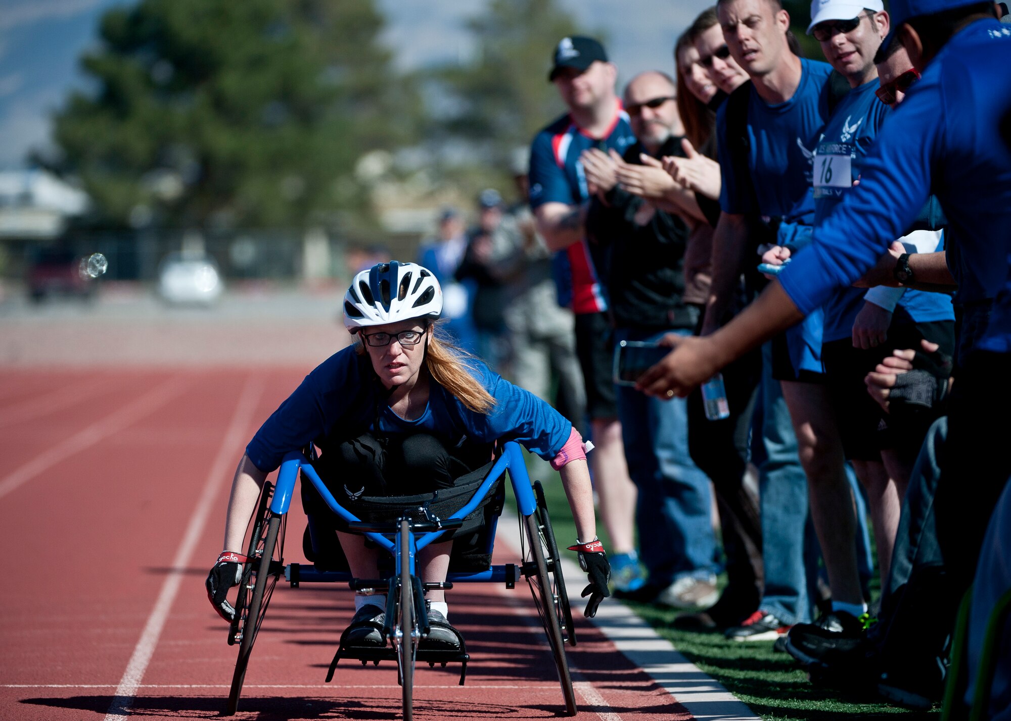 Kristina Morin, 2015 U.S. Air Force Trials participant, heads toward the finish line of a 1500-meter race at Nellis Air Force Base, Nev., March 3, 2015. During the trials, participants will be competing for a spot on the 2015 U.S. Air Force Wounded Warrior Team, which will represent the Air Force at adaptive sports events throughout the year.  (U.S. Air Force photo by Staff Sgt. Siuta B. Ika)
