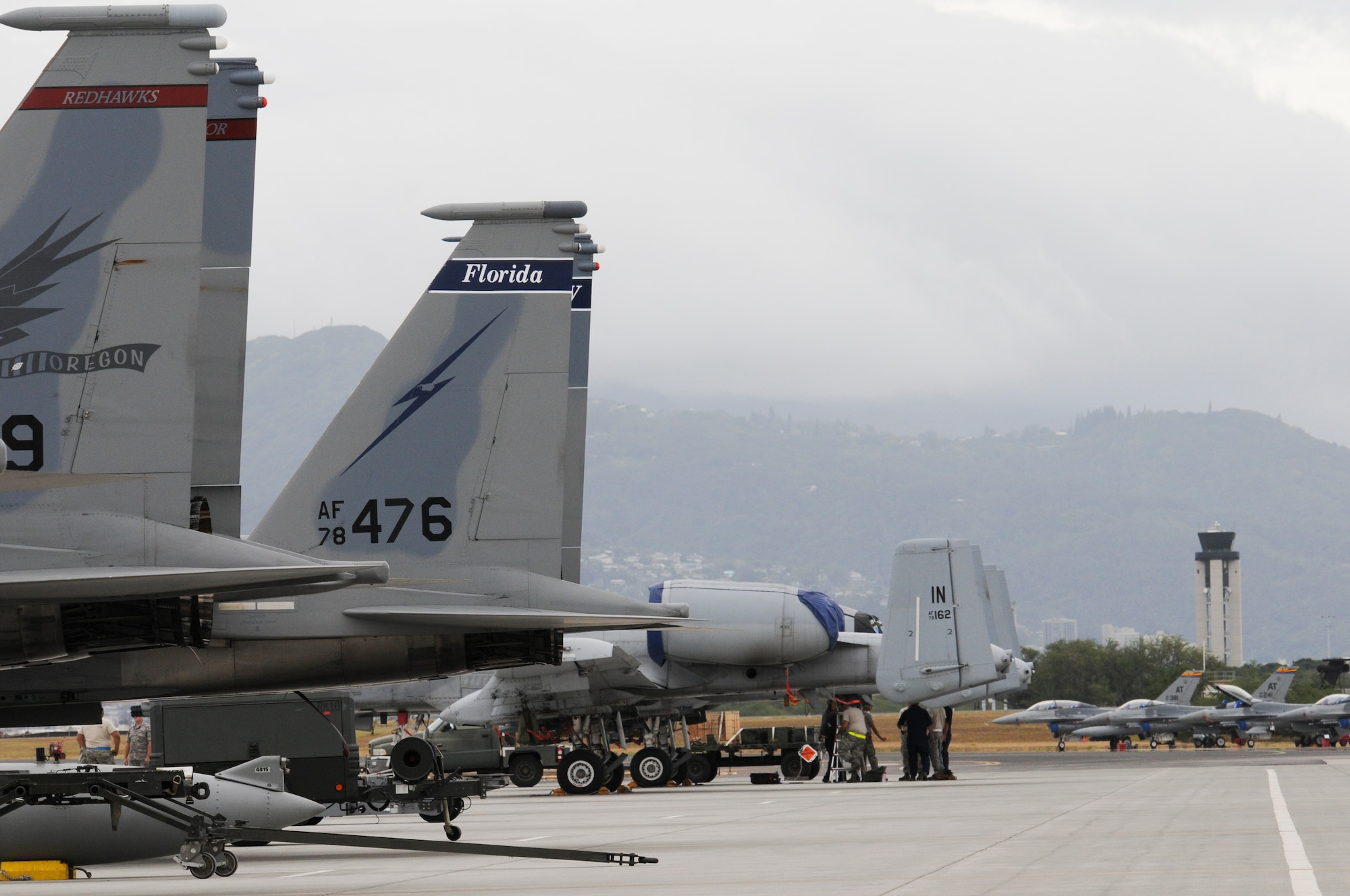 F-15 Eagles from Oregon and Florida, and A-10 Thunderbolts and F-16 Fighting Falcons from Arizona line the flight line at Joint Base Pearl Harbor-Hickam, Hawaii, March 4, 2015. The aircraft are participating in the Hawaii Air National Guard's Sentry Aloha fighter exercise. Sentry Aloha's mission is to provide the ANG, Air Force and DOD counterparts with multifaceted, realistic and integrated training to equip the warfighter with the skillsets necessary to fly, fight and win. (U.S. Air National Guard photo by Senior Airman Orlando Corpuz)

