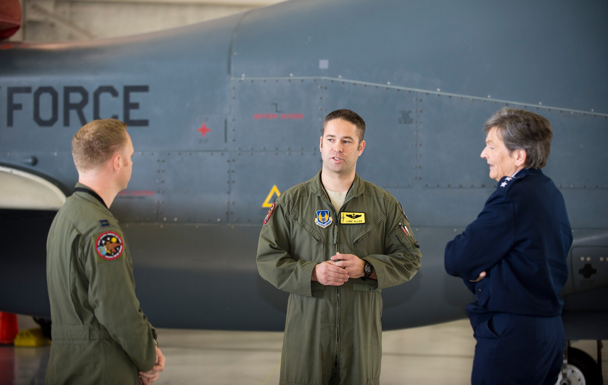 Maj. Luke Allen (center), Global Vigilance Combined Test Force pilot, speaks with Lt. Gen. Ellen M. Pawlikowski in front of an RQ-4 Global Hawk March 3. (U.S. Air Force photo by Ethan Wagner)