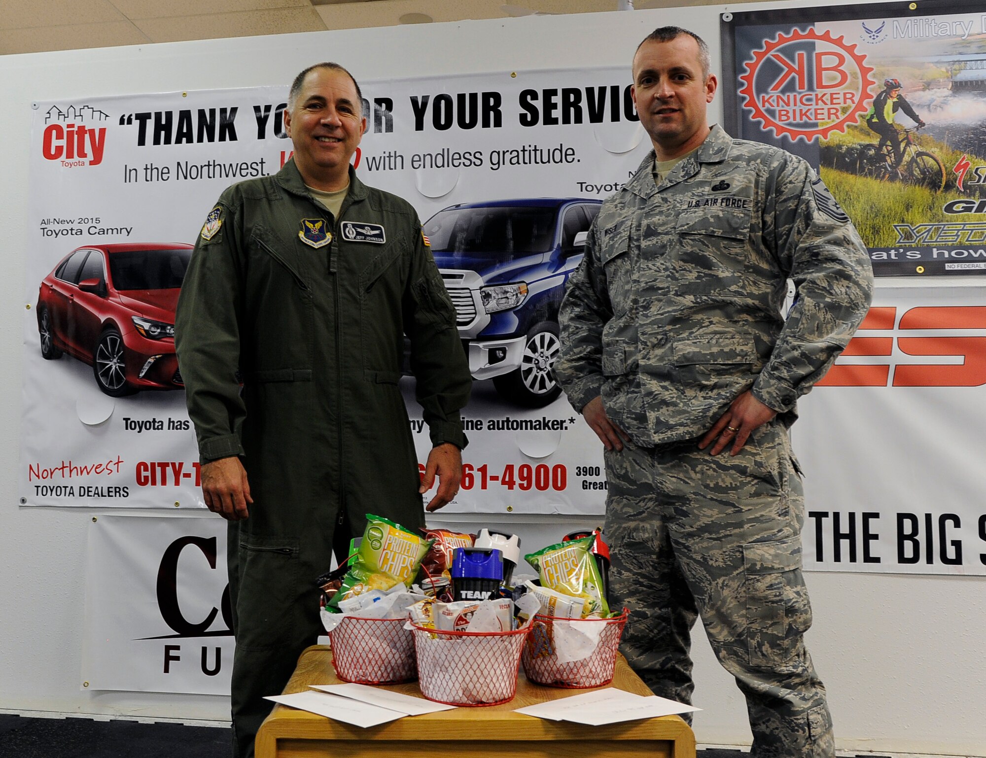 Lt. Col. Jeff Johnson, 341st Operations Group deputy commander and Master Sgt. Shawn Wiser, 341st OG first sergeant accept their award for winning the team category of the Largest Loser Competition held at Malmstrom Air Force Base, Mont.  Lt Col Justin Mulkey, 341st Operations Support Squadron commander and 1st Lt. Rich Gannon 12th Missile Squadron ICBM instructor combat crew commander were also part of the winning team that lost a collective amount of 42.2 pounds. (U.S. Air Force photo/Staff Sgt. Delia Marchick)