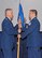 Colonel John Sullivan (right) relinquishes command of the 143d Airlift Wing Operations Group by passing the guidon to Colonel Arthur Floru, Commander, 143d AW at a ceremony held at Quonset Air National Guard Base, North Kingstown, Rhode Island on February 8, 2015. National Guard Photo by Technical Sgt Jason Long (RELEASED)