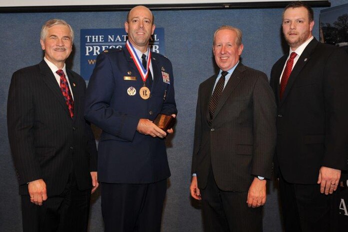 The National Society of Professional Engineers named Lt. Col. Patrick Miller, 628th Civil Engineer Squadron commander, as the nation’s top federal engineer during a ceremony Feb. 26, 2015 at the National Press Club in Washington, D.C.Standing (Left to right): NSPE President Harve D. Hnatiuk, P.E., F.NSPE; Lt. Col. Patrick Miller, P.E., U.S. Air Force; NSPE Executive Director Mark J. Golden, FASAE, CAE; and NSPE Board Member David Scott Wolf, P.E., PLS, F.NSPE. (Courtesy Photo / Christies Photography) 
