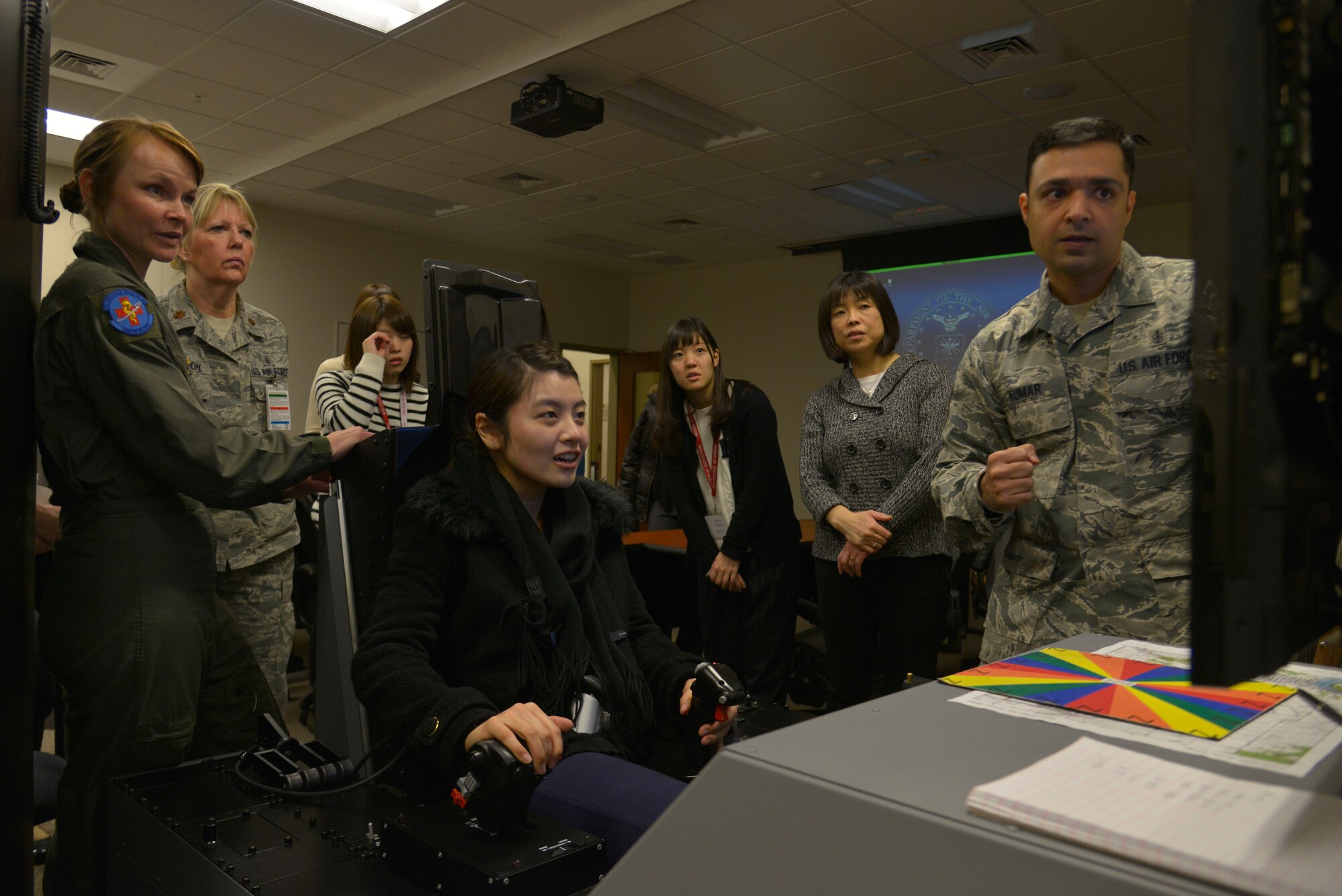 Maiko Saito, a nursing student from Iwate Prefectural University in Morioka, Japan, flies a simulated F-22 mission on the Hypoxia Familiarization Trainer during a base tour March 3, 2015, at Fairchild Air Force Base, Wash. The 92nd Medical Group hosted the tour to give the students a chance to experience the base and educate them about the 92nd MDG. (U.S. Air Force photo/Senior Airman Janelle Patiño)