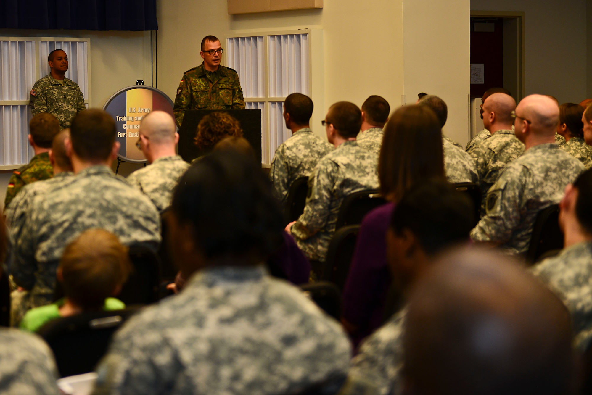 German Army Col. Johannes Nebe, Headquarters TRADOC senior German Army liaison officer, gives remarks during the German Armed Forces Proficiency Badge award ceremony at Fort Eustis, Va., March 3, 2015. The 20 Soldiers who received awards had to compete in athletic and military skills, including swimming, track and field and marksmanship challenges. (U.S. Air Force photo by Senior Airman Kimberly Nagle/Released)