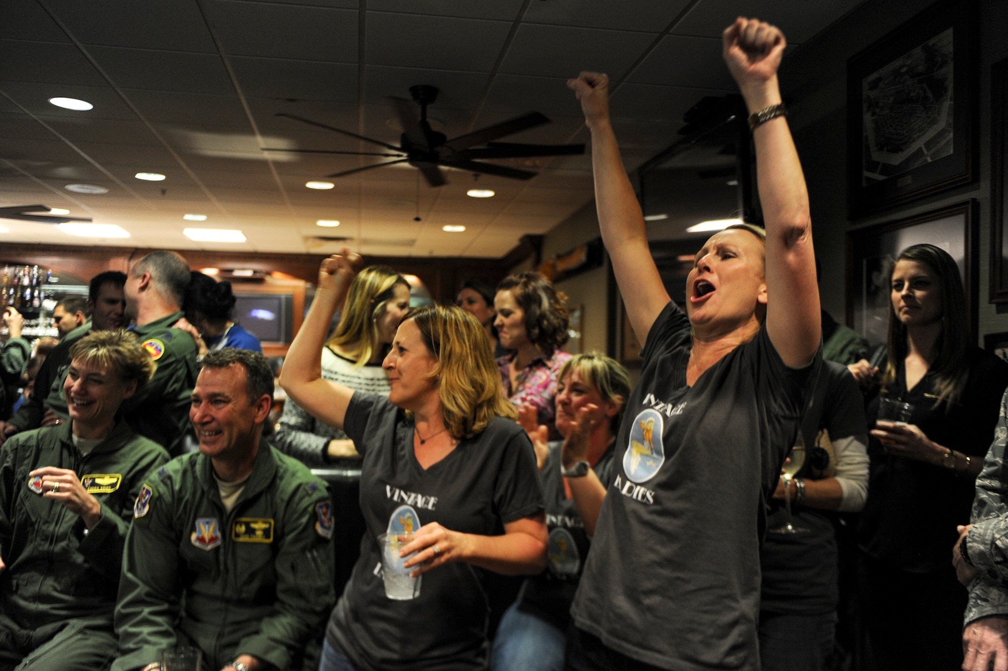 Erin Locke, wife of U.S. Air Force Col. Joseph Locke, 93d Air Ground Operations Wing commander, cheers on other spouses during the Moody Air Force Base Annual Wives Crud Tournament Feb. 27, 2015, at Moody AFB, Ga. Locke was a member of The Vintage Ladies team. (U.S. Air Force photo by Andrea Jenkins/Released)

