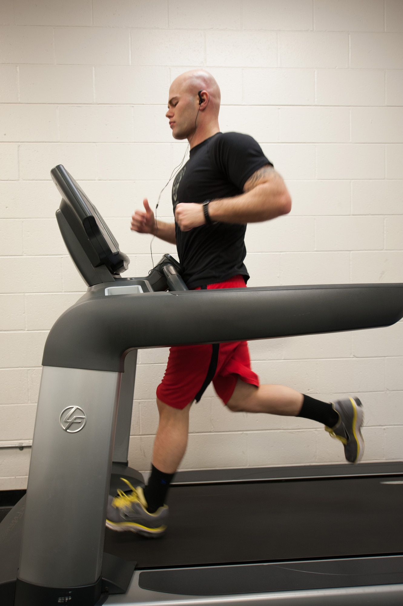 Senior Airman Shane Phipps, 30th Space Wing Public Affairs photojournalist, runs on a treadmill, March 4, 2015, Vandenberg Air Force Base, Calif. Since March is National Nutrition Month, members of the armed forces are provided an opportunity to assess their current fitness levels. (U.S. Air Force photo by Michael Peterson/Released)
