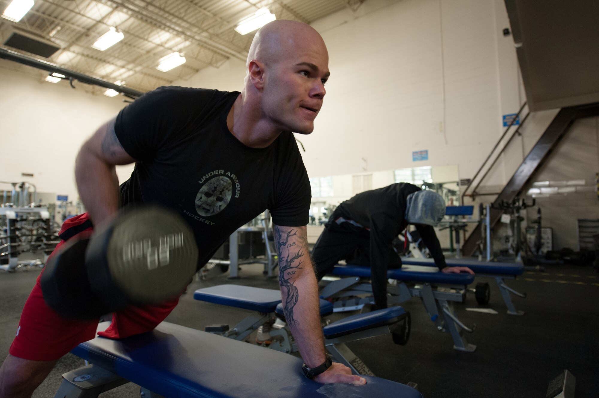 Senior Airman Shane Phipps, 30th Space Wing Public Affairs photojournalist, performs a weight lift, March 4, 2015, Vandenberg Air Force Base, Calif. Since March is National Nutrition Month, members of the armed forces are provided an opportunity to assess their current fitness levels. (U.S. Air Force photo by Michael Peterson/Released)