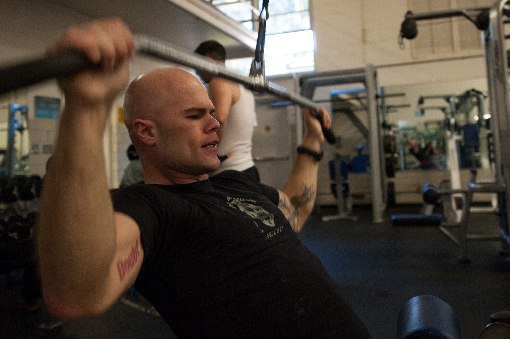 Senior Airman Shane Phipps, 30th Space Wing Public Affairs photojournalist, performs a weight lift, March 4, 2015, Vandenberg Air Force Base, Calif. Since March is National Nutrition Month, members of the armed forces are provided an opportunity to assess their current fitness levels. (U.S. Air Force photo by Michael Peterson/Released)