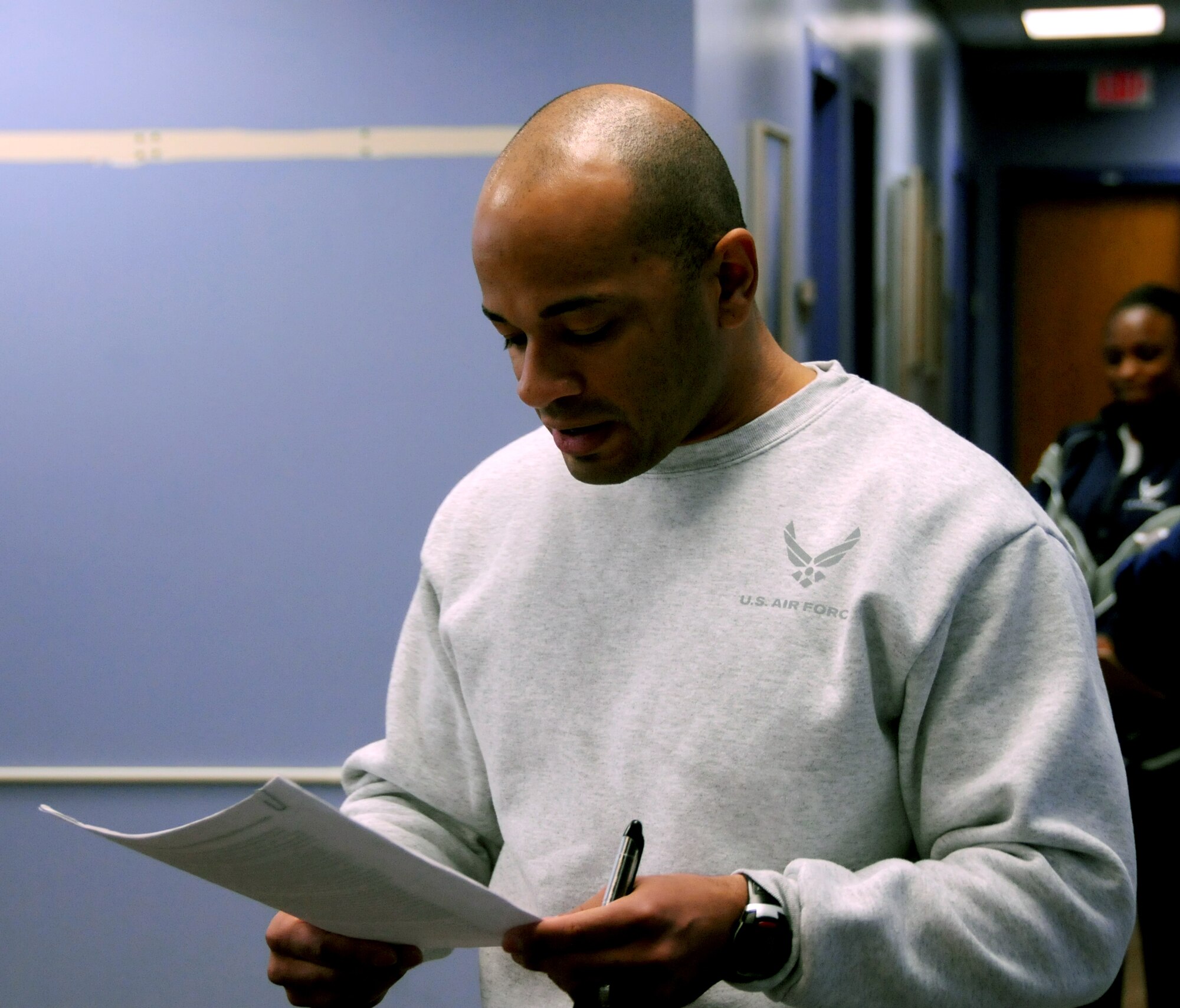Master Sgt. Roberto Mercado, 192nd Fighter Wing Services Flight superintendent, instructs PT testers on the proper form for performing pushups and sit-ups during a PT evaluation conducted on February 21, 2015 at Joint Base Langley-Eustis, Va. This was the first PT evaluation organized and conducted by the 192nd FW’s new Fitness Assessment Cell. The FAC team assesses airmen on their strength and endurance to ensure they are fit to fight and ready to carry out the Air Force mission. (U.S. Air National Guard photo by Airman 1st Class Johnisa B. Roberts/Released)


