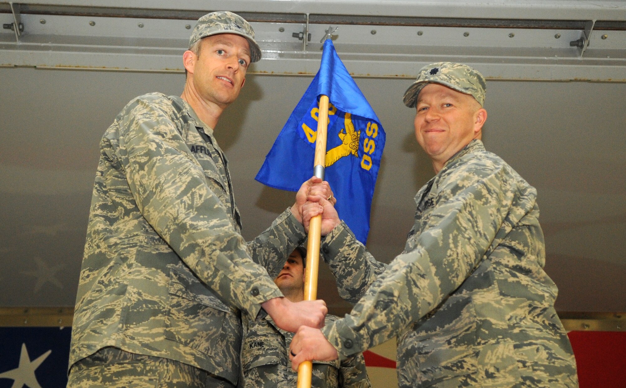 Lt. Col. Ernesto Divittorio, 4th Operations Support Squadron incoming commander, accepts the guidon from Col. Brian Afflerbaugh, 4th Operations Group commander, at the squadron’s change of command ceremony at Seymour Johnson Air Force Base, North Carolina, Feb. 27, 2015. Divittorio accepted command of the squadron which was formerly led by Lt. Col. Christine Mau. (U.S. Air Force photo/Senior Airman Ashley J. Thum)