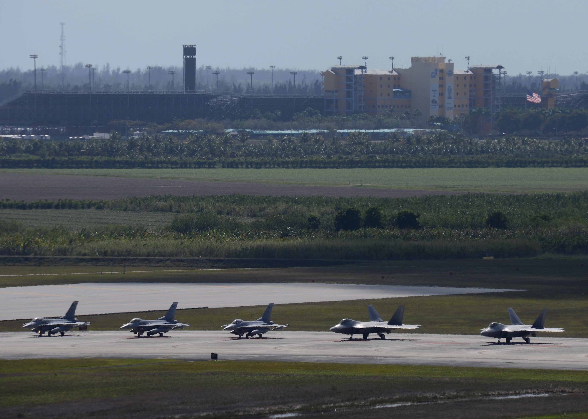 Pilots in both F-16 and F-22 aircraft wait for clearance from the tower to take-off Mar. 2 during CHUMEX at Homestead Air Reserve Base, Fla. The 482nd Fighter Wing, Homestead ARB, held a large force exercise, CHUMEX, bringing together multiple units and aircraft for training focused on teamwork and real-world combat scenarios. (U.S. Air Force photo by Staff Sgt. Jaimi L. Upthegrove)