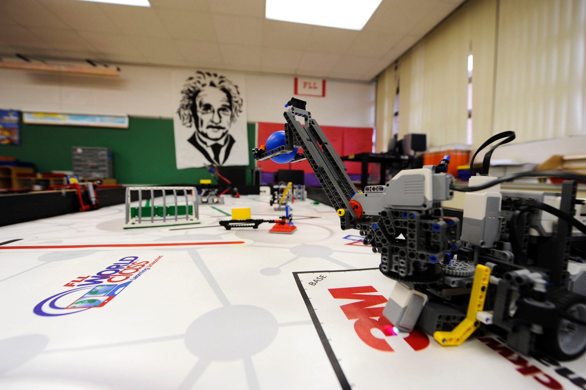Double “O” Robots’ first place winning robot ‘Frank’ sits on a thematic playing surface where it performs numerous tasks at Maxwell Elementary-Middle School, Maxwell Air Force Base, Alabama, March 2, 2015. The robot completes tasks through computer programming designed by students and downloaded to the robot.  (U.S. Air Force photo by Airman 1st Class Alexa Culbert/Cleared)
