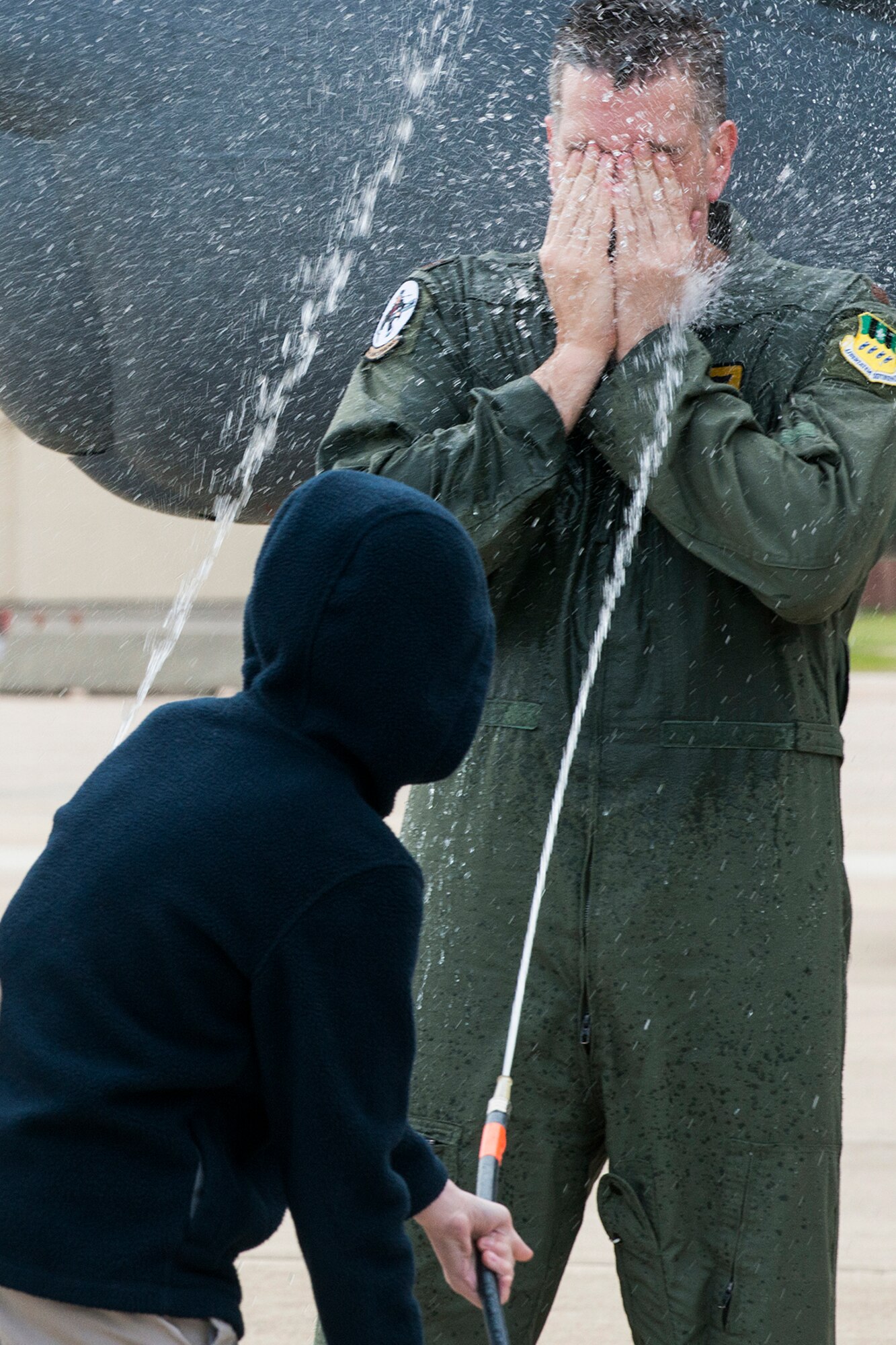 U.S. Air Force Maj. Matthew Callow gets it in the face after returning from his last flight in a B-52H Stratofortress, Feb. 5, 2015, Barksdale Air Force Base, La. Callow, a 11th Bomb Squadron B-52 pilot, is retiring from the Air Force after 20 years of service. (U.S. Air Force photo by Master Sgt. Greg Steele/Released)