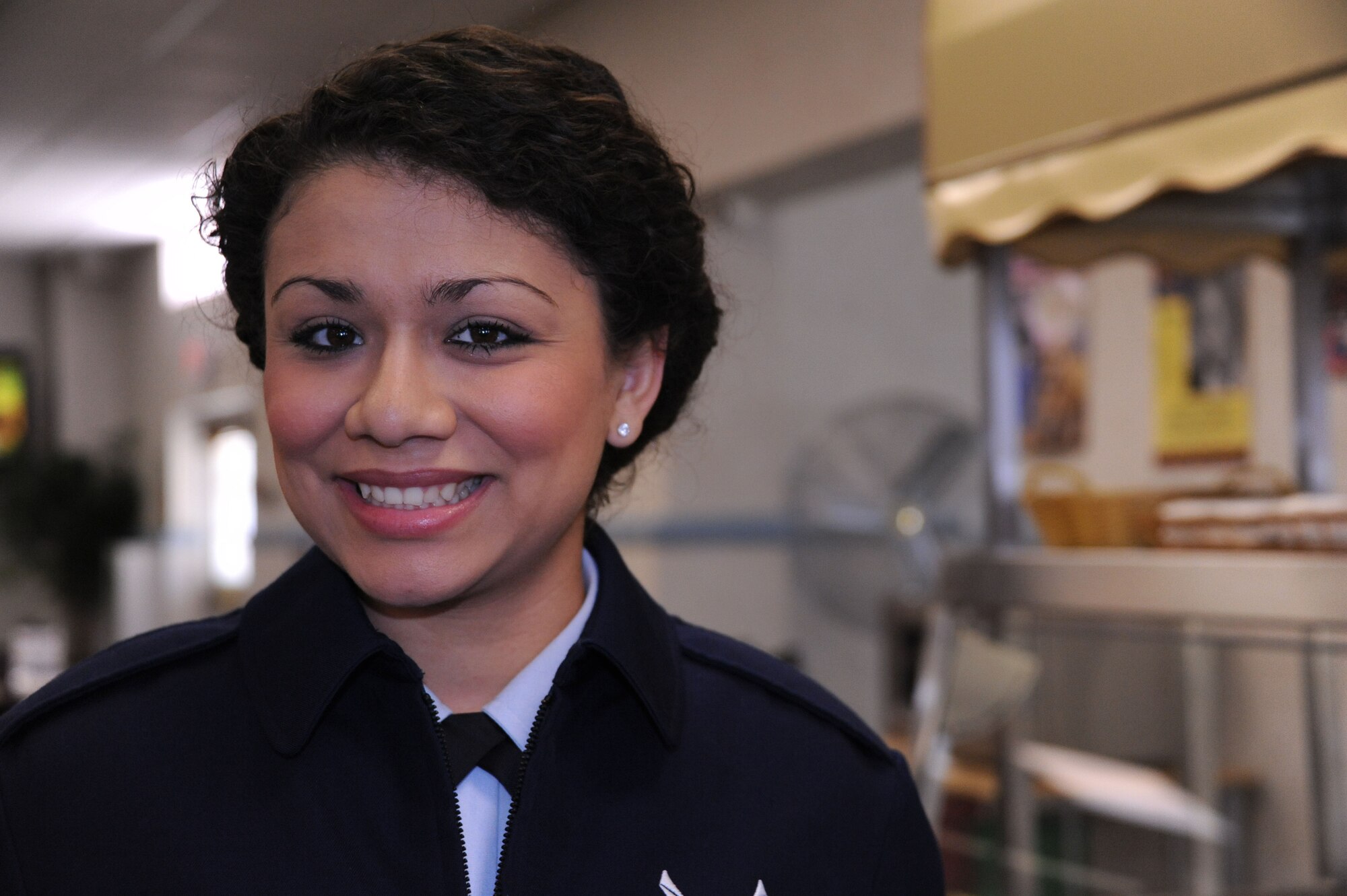 Airman Georgina Flores, 42nd Medical Group medical records technician, grabs some ice cream on her way back from lunch at the River Front Inn dining facility, Maxwell Air Force Base, Alabama, Feb. 27, 2015. Flores is from California and says her favorite thing to do is to hang out with friends and travel to the surrounding states. (U.S. Air Force photo by Airman 1st Class Alexa Culbert/Cleared)