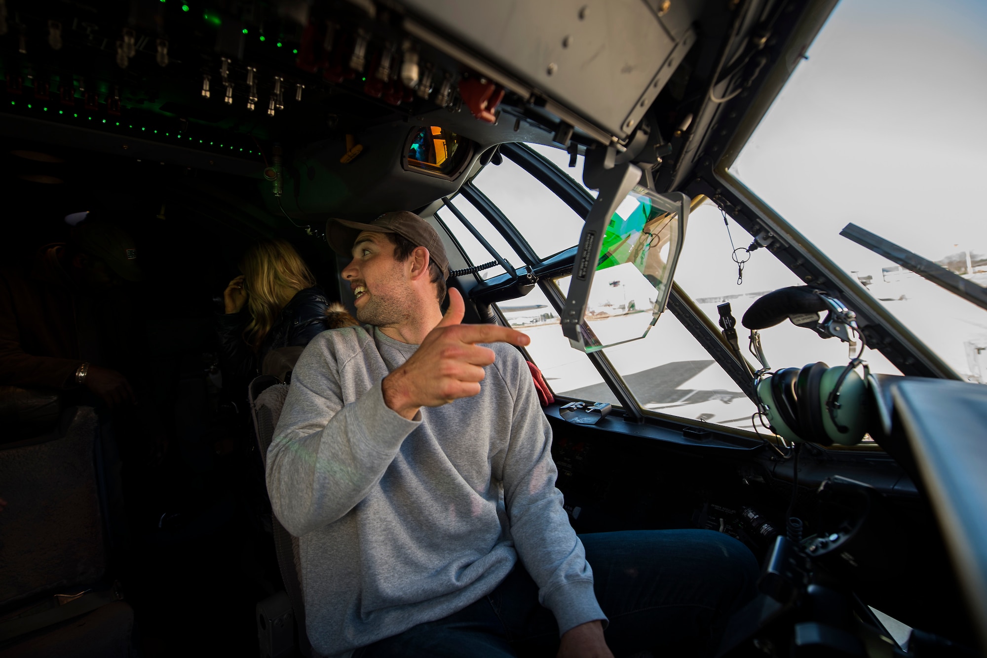 Andrew Luck, Indianapolis Colts quarterback, checks out a heads-up display on a U.S. Air Force C-130J Super Hercules during the USO Spring Visit at Ramstein Air Base Germany, March 3, 2015. For their first stop of a multi-country tour, the USO brought Indianapolis Colts players Andrew Luck and Dwayne Allen, Colts coach Chuck Pagano, Pittsburgh Steelers player David DeCastro, entertainers Philip Phillips, Dennis Haysbert, Miss America 2015, Ace Young, Diana DeGarmo, and Jason “Wee Man” Acuna to Ramstein to visit military members and their families. (U.S. Air Force photo/Senior Airman Damon Kasberg) 