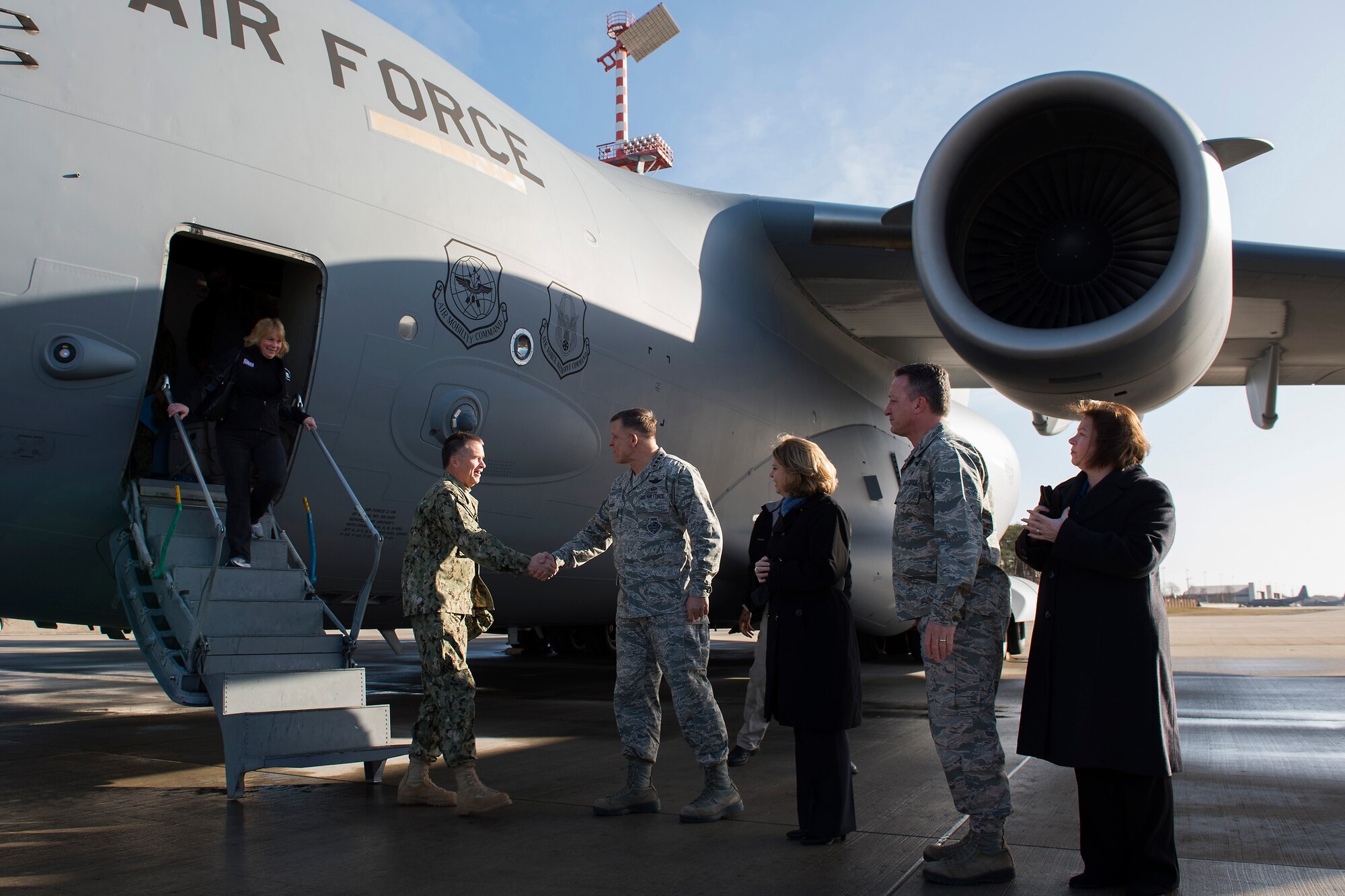 Admiral James A. Winnefeld, Jr., left, Vice Chairman of the Joint Chiefs of Staff, is greeted by Gen. Frank Gorenc, U.S. Air Forces in Europe and Air Forces Africa commander, during the USO Spring Visit at Ramstein Air Base, Germany, March 3, 2015. For their first stop of a multi-country tour, the USO brought Indianapolis Colts players Andrew Luck and Dwayne Allen, Colts coach Chuck Pagano, Pittsburgh Steelers player David DeCastro, entertainers Philip Phillips, Dennis Haysbert, Miss America 2015, Ace Young, Diana DeGarmo, and Jason “Wee Man” Acuna to Ramstein to visit military members and their families. (U.S. Air Force photo/Senior Airman Damon Kasberg) 