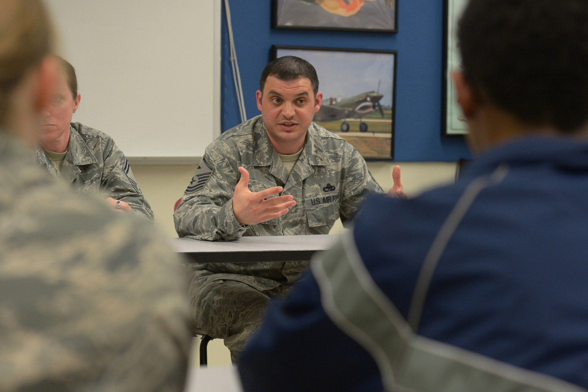Master Sgt. Nicholas Souza, 66th Comptroller Squadron and 66th Air Base Group Staff Agency first sergeant, shares his experience with Air Force Reserve Officer Training Corps cadets from Harvard University, Tufts University, Wellesley College, Massachusetts Institute of Technology during a mentoring session Feb. 24 on the MIT campus. Ten Senior NCOs from Hanscom Air Force Base and varying backgrounds participated in the event. (U.S. Air Force photo by Jerry Saslav)   