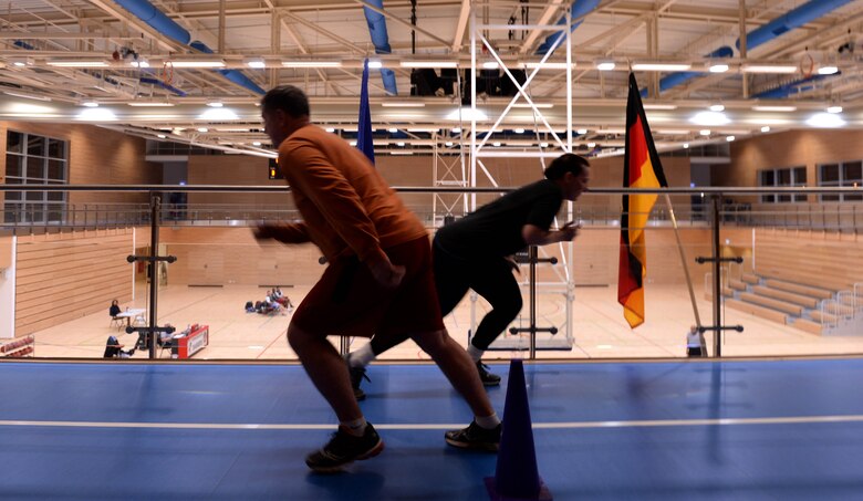 Participants of the Largest Loser campaign run in a relay race during the Turbo-Charged Challenge #2 at the Eifel Powerhaus at Spangdahlem Air Base, Germany, Jan. 27, 2015. A total of eight people participated in the event and split into two teams of four as part of the six-week campaign designed to promote fitness and health awareness. (U.S. Air Force photo by Airman 1st Class Timothy Kim/Released)