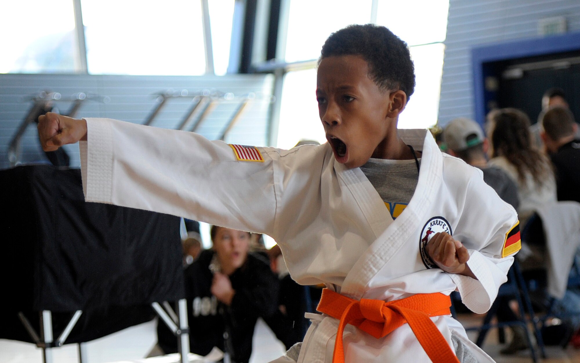 Eric Slater demonstrates a punch as part of his routine during the 15th annual U.S. Air Forces in Europe martial arts tournament at Ramstein Air Base, Germany, Feb. 28, 2015. Five martial arts schools brought more than 200 students to participate in the tournament. (U.S. Air Force photo/Senior Airman Timothy Moore)