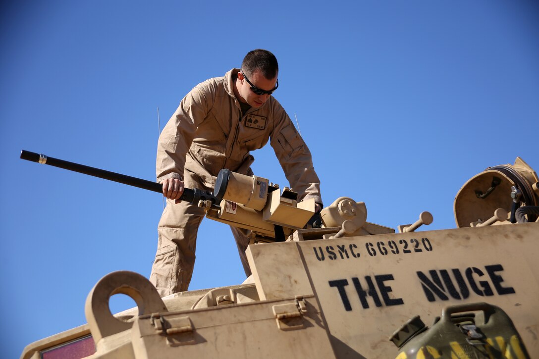 Marine Corps Sgt. Cody Olson, a main battle tank repairer/technician with Combat Logistics Battalion 24, 24th Marine Expeditionary Unit, assembles an M2 .50-caliber heavy machine gun on an M88A2 Hercules Armored Recovery Vehicle during an exercise Feb. 8, 2015. U.S. Marine Corps photo by Sgt. Devin Nichols