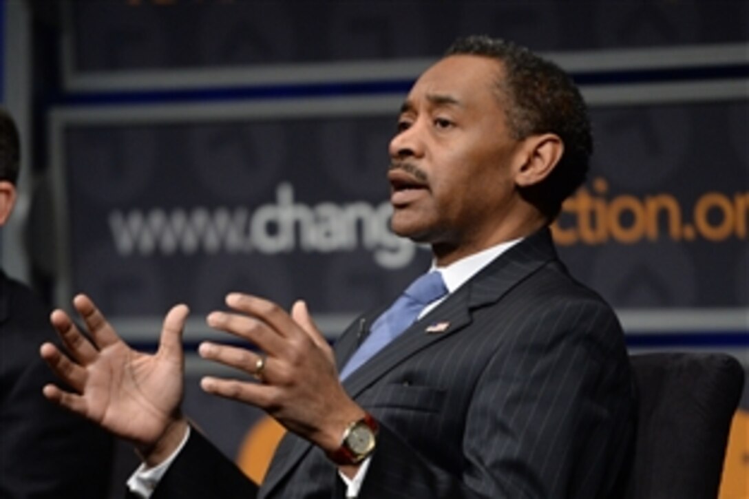 Assistant Defense Secretary for Health Affairs Jonathan Woodson discusses mental health concerns among veterans during a symposium at the Newseum in Washington, D.C., March 4, 2015.
