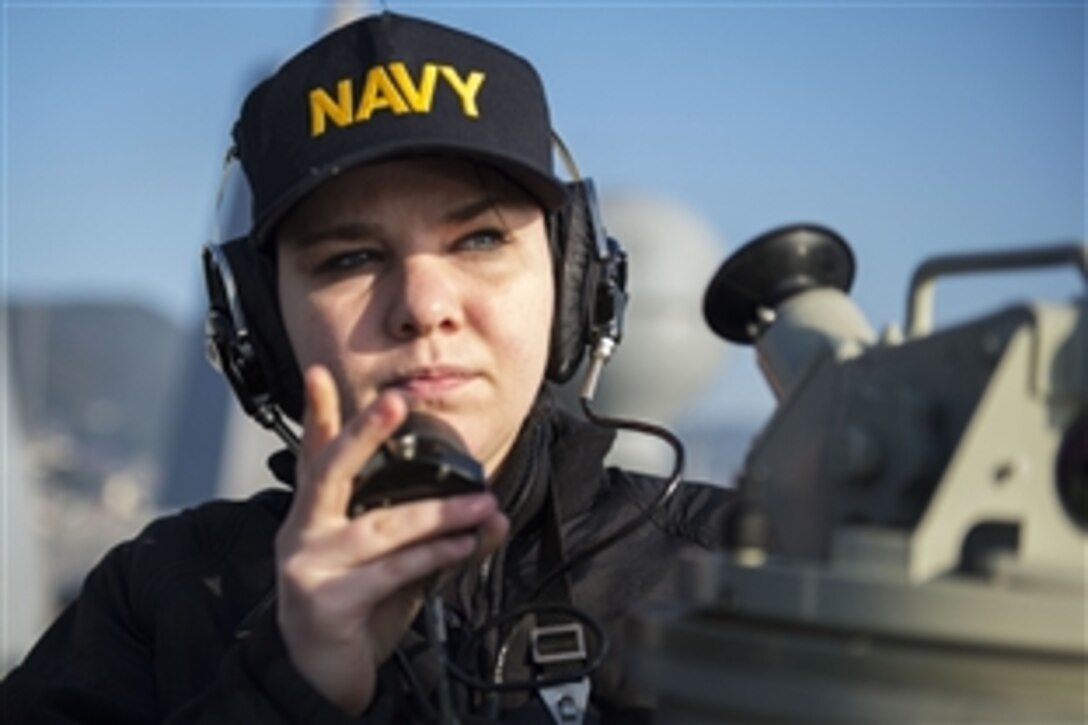 U.S. Navy Seaman Savannah Williams relays bearings on the amphibious transport dock ship USS Green Bay in Sasebo, Japan, Feb. 25, 2015.