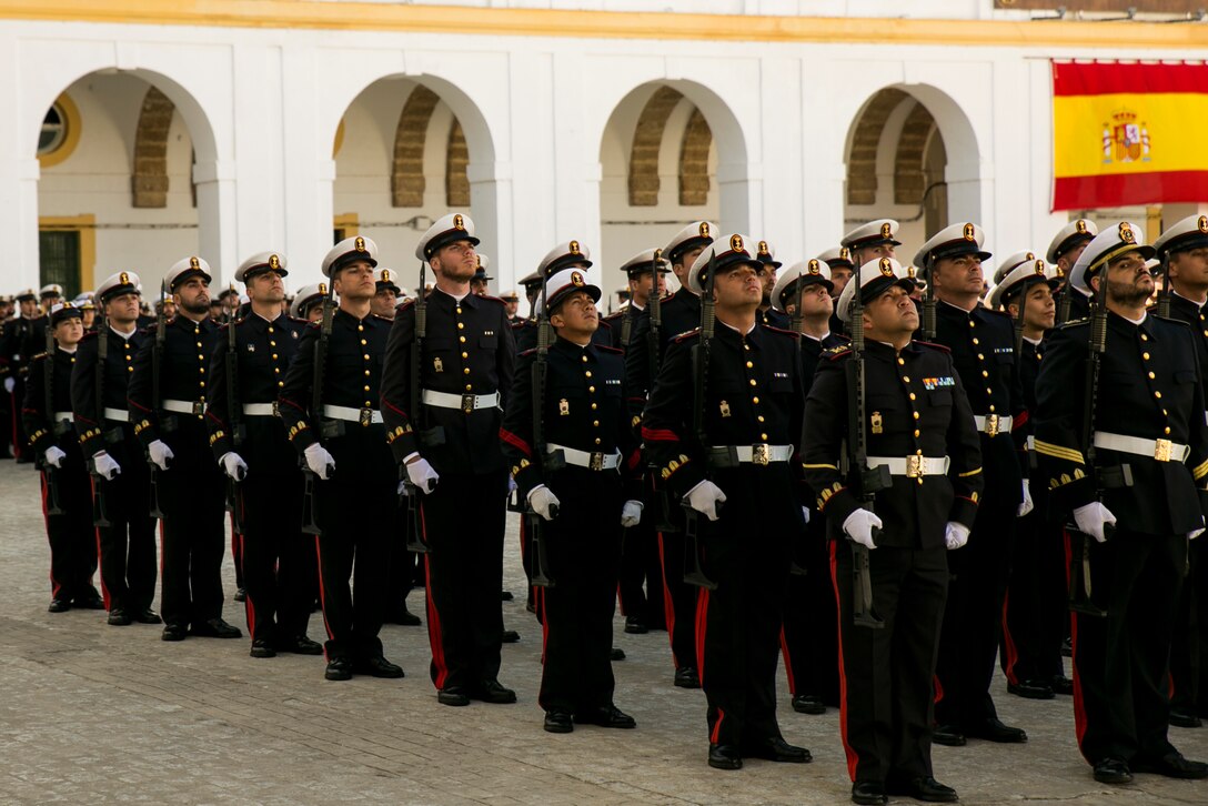 Spanish Marines with 5th Rifle Company, 2nd Battalion raise their gaze as a symbol of respect to the national colors during the Spanish Marine Corps’ 478th anniversary parade near San Fernando, Spain, Feb. 27, 2015. The parade included a memorial to fallen comrades as well as a ceremonial pass-and-review before the official party. This is the first time U.S. Marines with Special-Purpose Marine Air-Ground Task Force Crisis Response-Africa attended the ceremony as a testament to the partnership between the NATO allies and the shared bond between Marines. (U.S. Marine Corps photograph by 1st Lt. Danielle Dixon/Released)