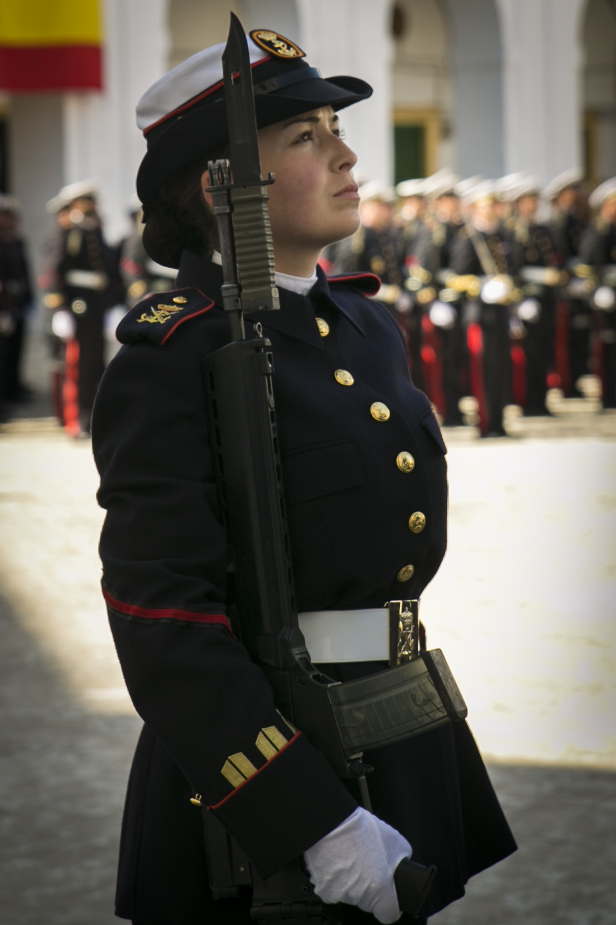 A Spanish Marine with Headquarters and Services Company, 2nd Infantry Battalion raises her gaze as a symbol of respect to the national colors during the Spanish Marine Corps’ 478th anniversary parade near San Fernando, Spain, Feb. 27, 2015. Colonel Thomas B. Savage and Sgt. Maj. James Boutin, the commanding officer and sergeant major of Special-Purpose Marine Air-Ground Task Force Crisis Response-Africa, attended the ceremony as a testament to the partnership between the NATO allies and the shared bond between Marines. (U.S. Marine Corps photograph by 1st Lt. Danielle Dixon/Released)