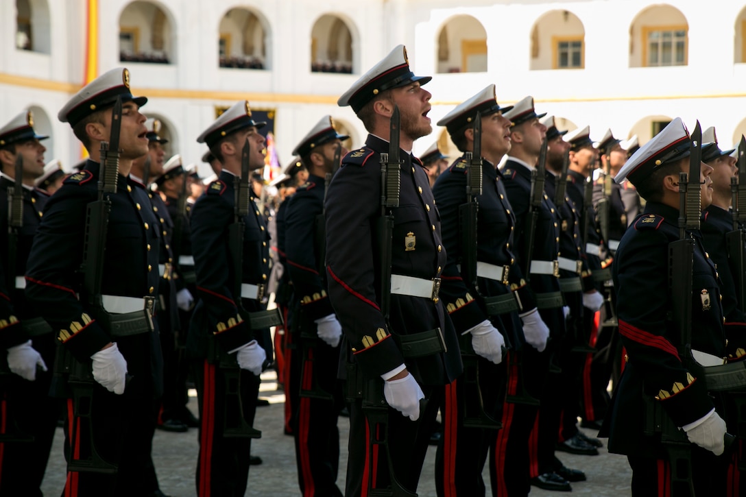 Spanish Marines with 5th Rifle Company, 2nd Battalion sing Spanish Marine Corps Hymn “Marcha Heróica” during their 478th anniversary parade near San Fernando, Spain, Feb. 27, 2015. The parade included a memorial to fallen comrades as well as a ceremonial pass-and-review before the official party. This is the first time U.S. Marines with Special-Purpose Marine Air-Ground Task Force Crisis Response-Africa attended the ceremony as a testament to the partnership between the NATO allies and the shared bond between Marines. (U.S. Marine Corps photograph by 1st Lt. Danielle Dixon/Released)