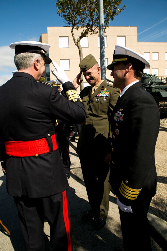 U.S. Marine Corps Colonel Thomas B. Savage, Special-Purpose Marine Air-Ground Task Force Crisis Response-Africa’s commanding officer (center), salutes Spanish Marine Corps Commandant, Major General Vicente (left), after an introduction from U.S. Navy Capt. Greg Pekari (right), the commanding officer of Naval Station Rota, Spain. This is the first time U.S. Marines with Special-Purpose Marine Air-Ground Task Force Crisis Response-Africa attended the ceremony as a testament to the partnership between the NATO allies and the shared bond between Marines. (U.S. Marine Corps photograph by 1st Lt. Danielle Dixon/Released)