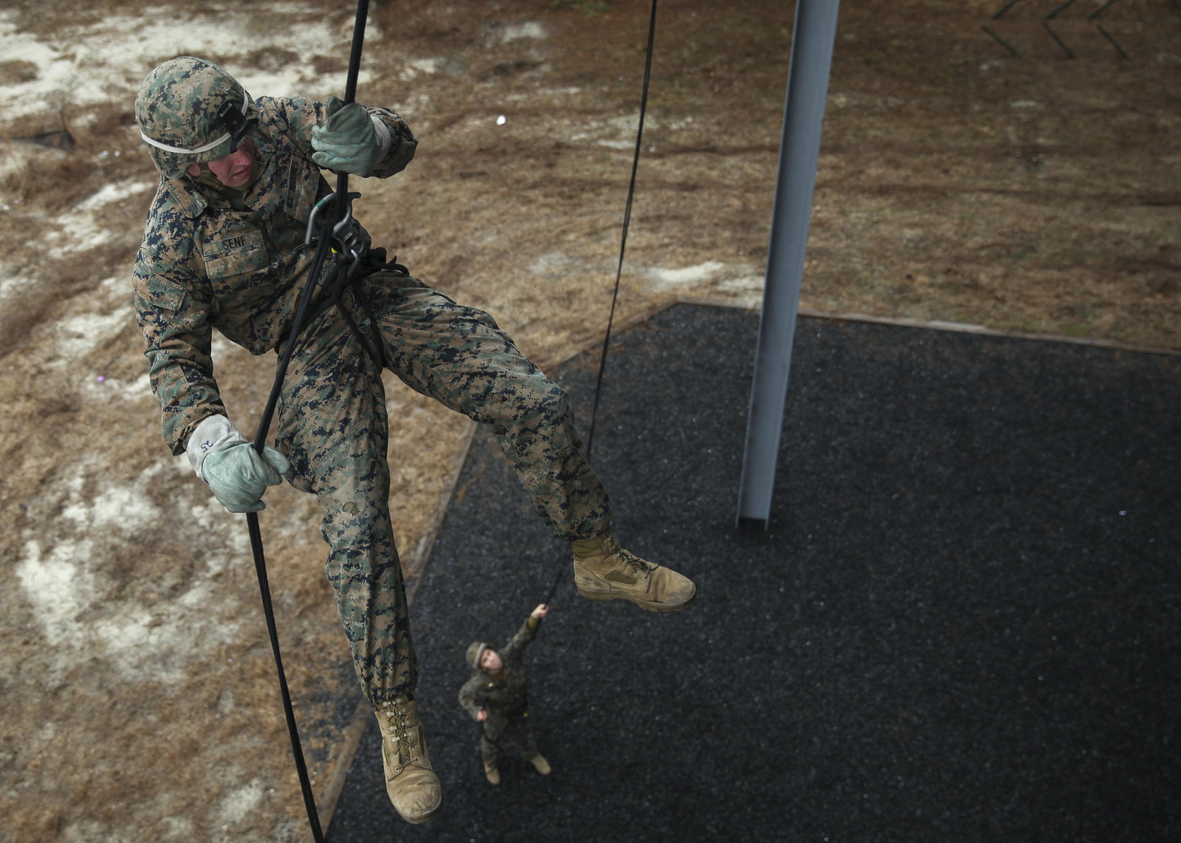 Marines learn to master the ropes during helicopter suspension