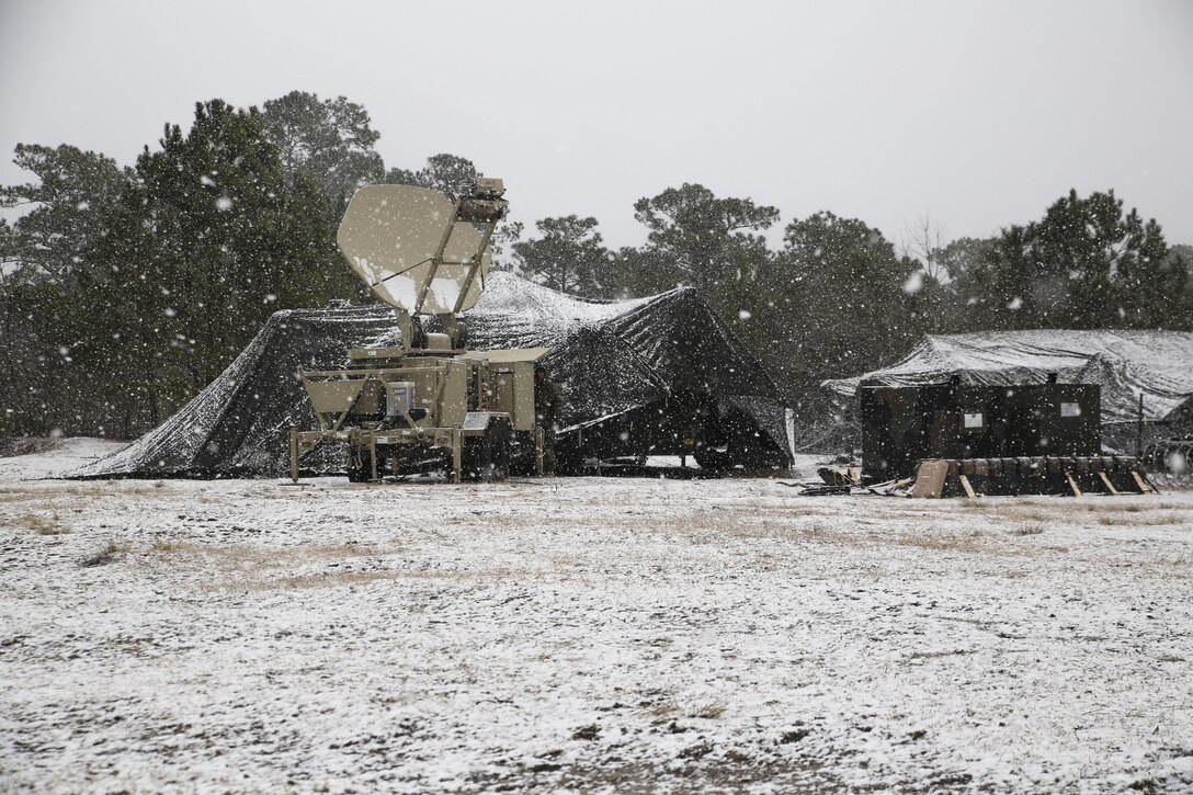 Snow falls over the command operations center during an entire day of a 2nd Marine Logistics Group command post exercise aboard Marine Corps Base Camp Lejeune, N.C., Feb. 24, 2015. The Marines involved in the CPX battled multiple weather conditions such as snow, sleet and rain during the exercise designed to ensure logistical readiness and identify areas in need of improvement. (U.S. Marine Corps Photo by Cpl. Chelsea D. Toombs/Released)