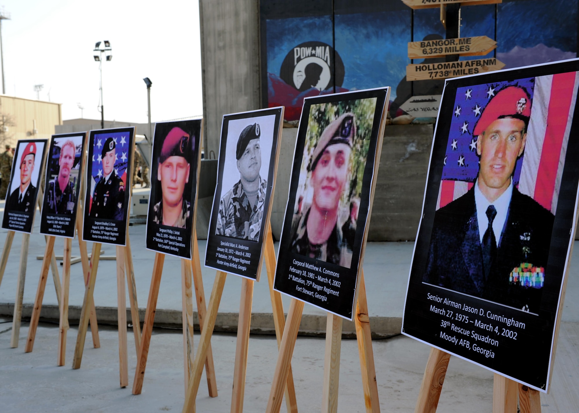 (From right to left) Posters of U.S. Air Force Senior Airman Jason Cunningham, U.S. Army Cpl. Matthew Commons, U.S. Army Spc. Marc Anderson, U.S. Army Sgt. Phillip Svitak, U.S. Army Sgt. Bradley Crose, U.S. Navy Petty Officer 1st Class Neil Roberts and U.S. Air Force Tech. Sgt. John Chapman, special operators killed during Operation Anaconda March 4, 2002, are displayed in preparation for a remembrance ceremony March 3, 2015 at Bagram Airfield, Afghanistan. Servicemembers from all branches conducted a 24-hour vigil run and a retreat ceremony to honor the 13th anniversary of their deaths and pay homage to a legacy of heroism. (U.S. Air Force photo by Staff Sgt. Whitney Amstutz/released)