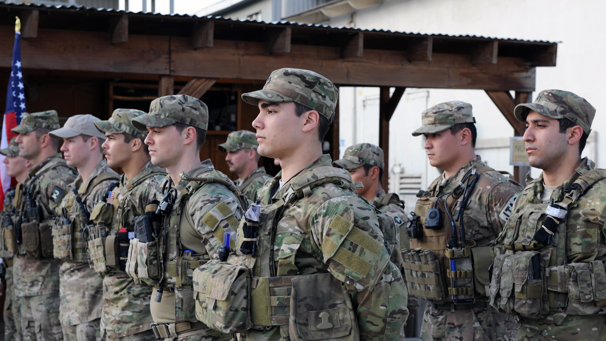 A multiservice formation of special operators stands at parade rest during a remembrance ceremony honoring special operators who were killed March 4, 2002 during Operation Anaconda: U.S. Air Force Senior Airman Jason Cunningham, U.S. Army Cpl. Matthew Commons, U.S. Army Spc. Marc Anderson, U.S. Army Sgt. Phillip Svitak, U.S. Army Sgt. Bradley Crose, U.S. Navy Petty Officer 1st Class Neil Roberts and U.S. Air Force Tech. Sgt. John Chapman, March 3, 2015 at Bagram Airfield, Afghanistan. Servicemembers from all branches conducted a 24-hour vigil run and a retreat ceremony to honor the 13th anniversary of their deaths and pay homage to a legacy of heroism. (U.S. Air Force photo by Staff Sgt. Whitney Amstutz/released)
