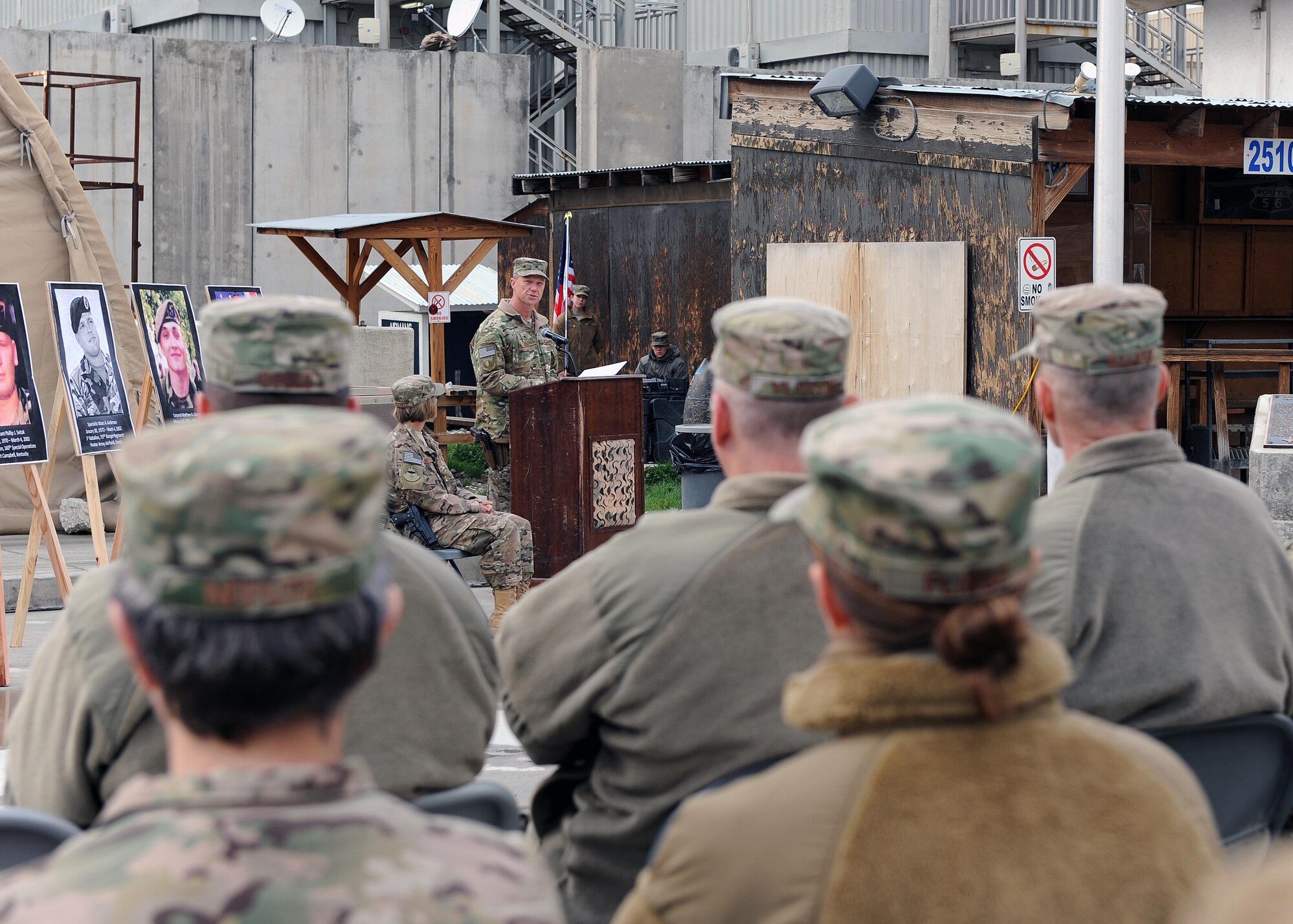 U.S. Air Force Brig. Gen. Mark Kelly, 455th Air Expeditionary Wing commander, speaks to an assembly of servicemembers during a remembrance ceremony honoring special operators who were killed March 4, 2002 during Operation Anaconda: U.S. Air Force Senior Airman Jason Cunningham, U.S. Army Cpl. Matthew Commons, U.S. Army Spc. Marc Anderson, U.S. Army Sgt. Phillip Svitak, U.S. Army Sgt. Bradley Crose, U.S. Navy Petty Officer 1st Class Neil Roberts and U.S. Air Force Tech. Sgt. John Chapman, March 4, 2015 at Bagram Airfield, Afghanistan. Servicemembers from all branches conducted a 24-hour vigil run and a retreat ceremony to honor the 13th anniversary of their deaths and pay homage to a legacy of heroism. (U.S. Air Force photo by Staff Sgt. Whitney Amstutz/released)