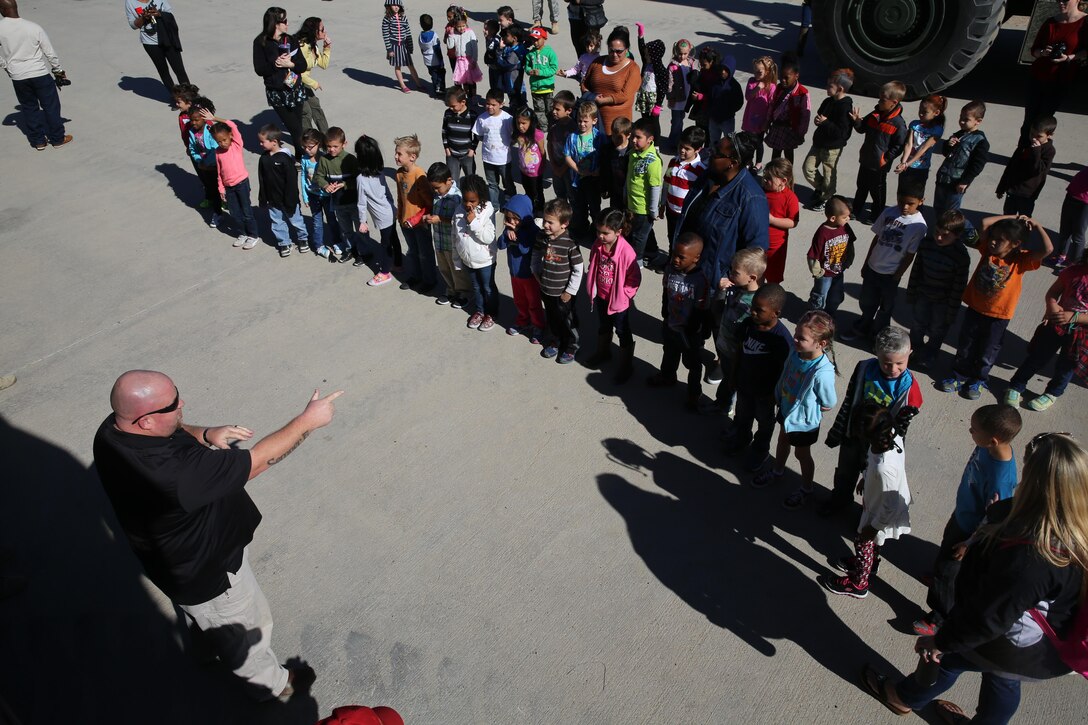 Students from Newberry Springs Elementary School visit the rail yard on Marine Corps Logistics Base Barstow, Calif., March 5. Chad Hildebrandt, rail operations supervisor here, and soldiers from the 171st Movement Control Company, based out of Fort Irwin, led the tour and answered questions. During the tour, children asked questions and received information about the importance of rail operations in the Department of Defense. They also walked through a static display of various military equipment and were able to go inside some of the vehicles. 