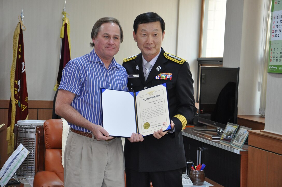 Robert Lamoureux, U.S. Army Corps of Engineers Far East District emergency management specialist, received a citizen heart saver award from Jungbu Fire Station Chief Kim Hyeong Cheol March 5 at the Jungbu Fire Station in Seoul, Korea. He was recognized as the first foreign citizen heart saver in Seoul. Lamoureux saved co-worker Jerry Giefer's life by performing cardio-pulmonary resuscitation (CPR) Dec. 30 at the Far East District compound. The citizen heart saver is a prestigious award given to a civilian assisting paramedics and revitalizing a person's life in cardiac arrest by participating in CPR.