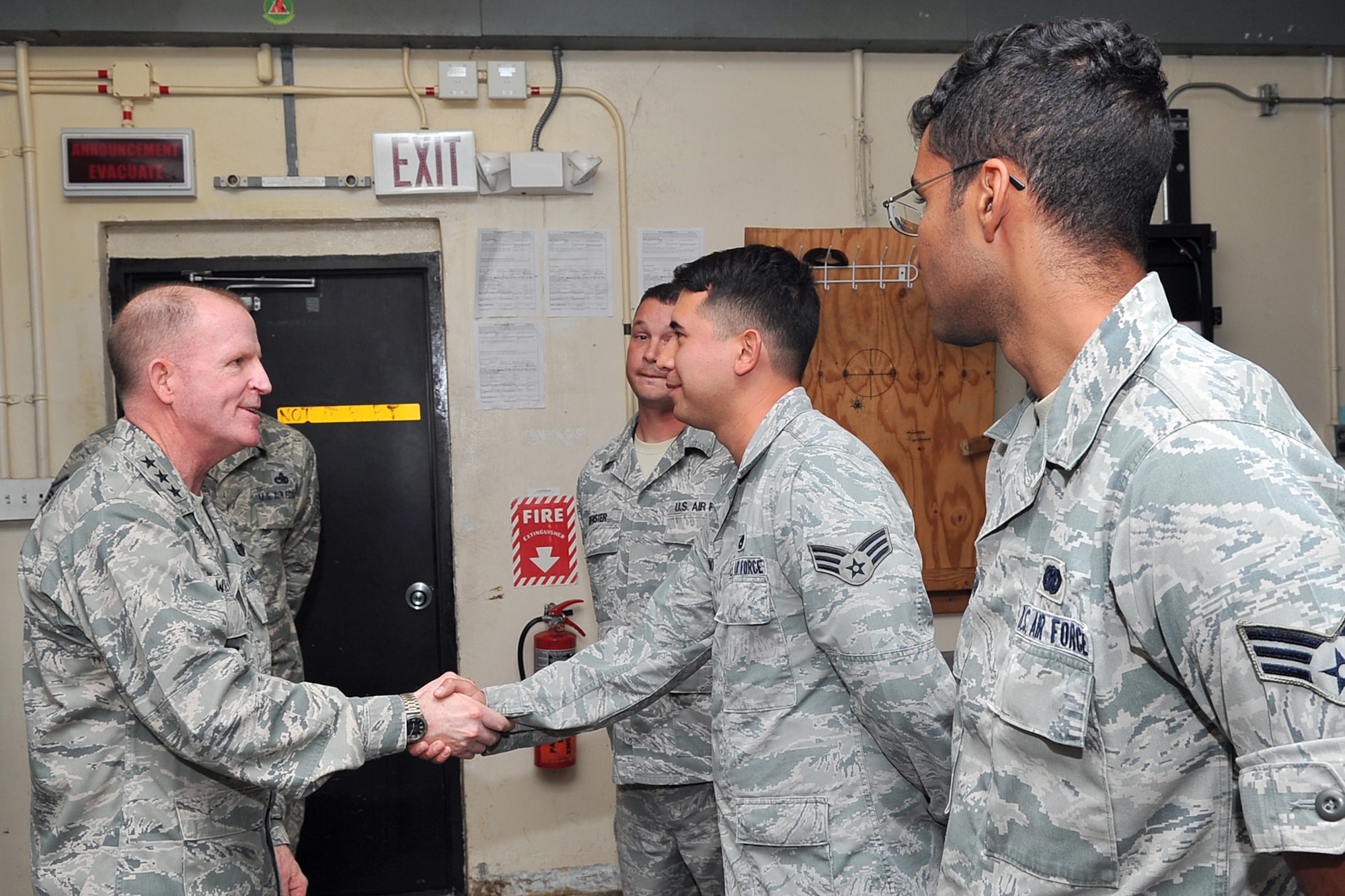 Lt. Gen. Stephen Wilson, commander of Air Force Global Strike Command, recognizes 36th Expeditionary Aircraft Maintenance Squadron Continuous Bomber Presence consolidated tool kit Airmen for their problem-solving initiatives March 3, 2015, at Andersen Air Force Base, Guam. Wilson met one-on-one with Airmen supporting the CBP mission in the Asia-Pacific region as well as recognized a handful of them who came up with problem-solving initiatives during their deployment here. (U.S. Air Force photo by Staff Sgt. Melissa B. White/Released)
