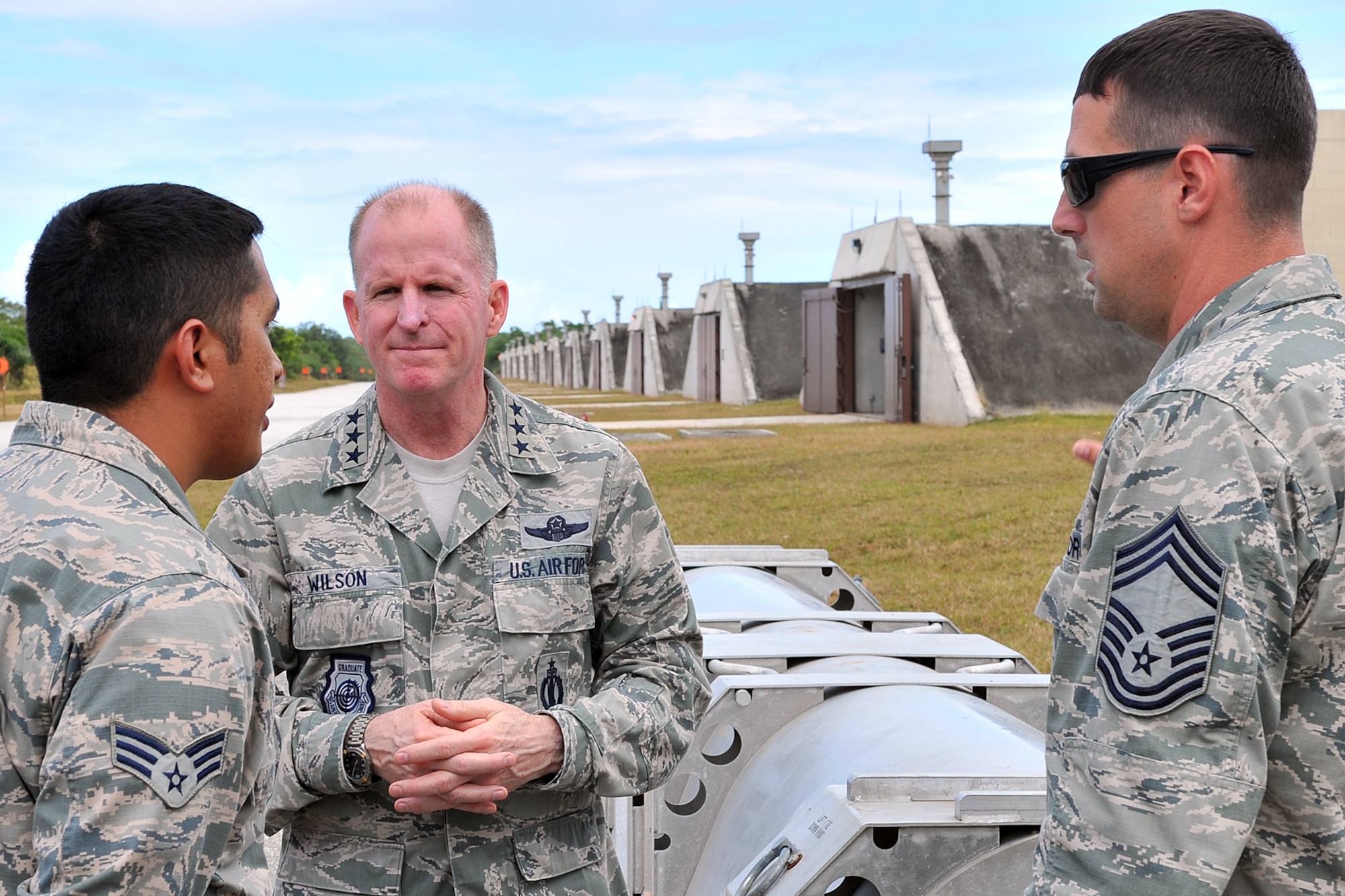 Lt. Gen. Stephen Wilson, commander of Air Force Global Strike Command, visits with Senior Airman J. Babauta, 36th Munitions Squadron munitions storage crew chief and scheduler, and Chief Master Sgt. Jason Menzel, 36th MUNS superintendent, March 3, 2015, at Andersen Air Force Base, Guam. Wilson received one-on-one feedback from Airmen supporting the Continuous Bomber Presence mission in the Asia-Pacific region. (U.S. Air Force photo by Staff Sgt. Melissa B. White/Released)