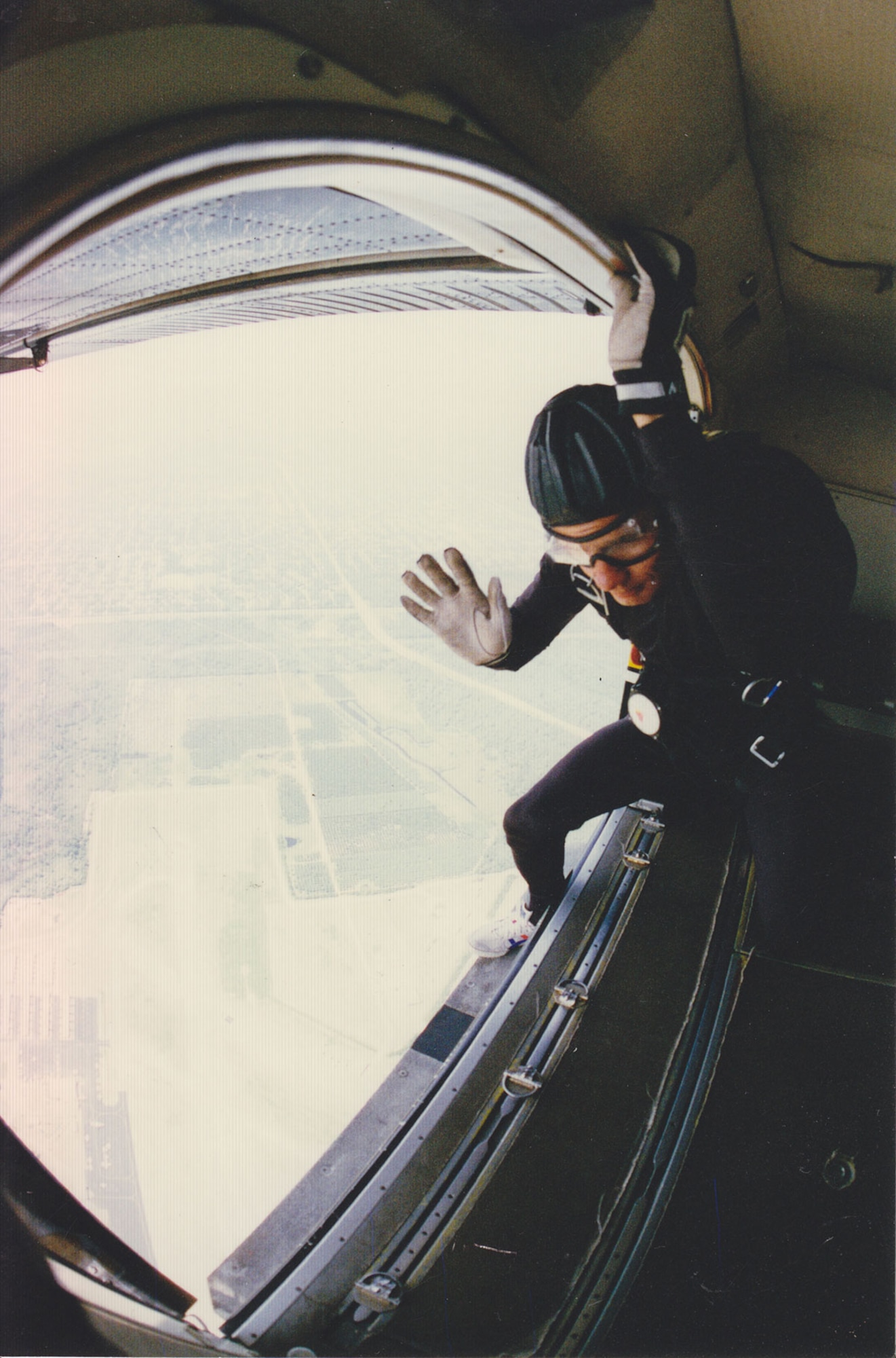 Chief Master Sgt. JJ Little, 3rd Wing command chief master sergeant, signals during a jump with the United States Army Parachute Team, the Golden Knights. Little served with the team for five years and has logged more than 3,000 jumps between his Army and Air Force service. (Courtesy photo)