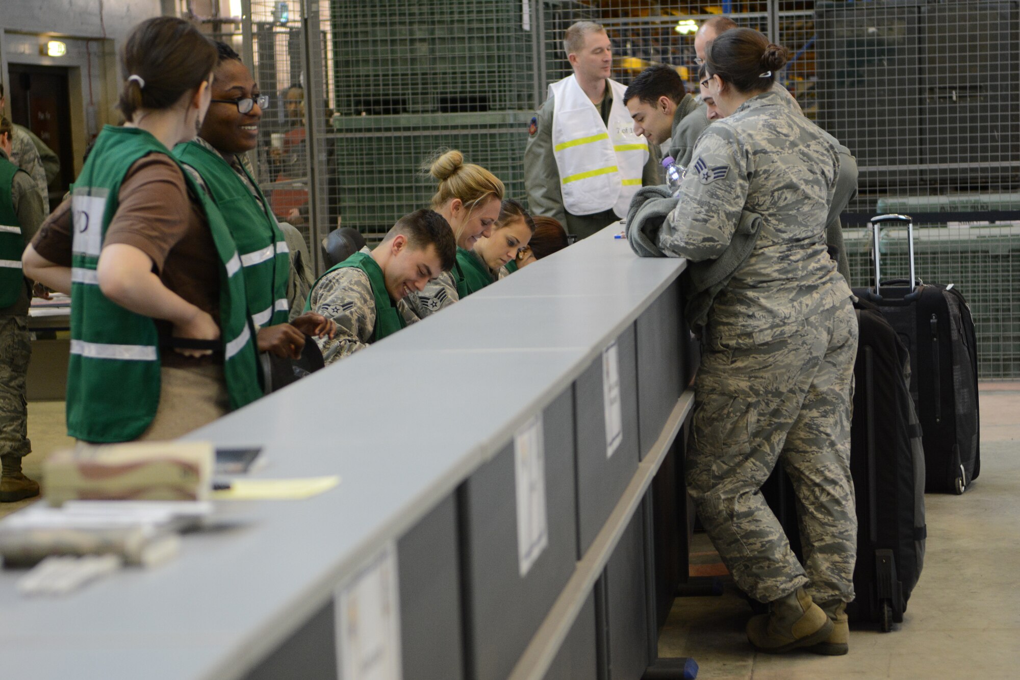 Airmen from the 115th Fighter Wing and Mildenhall Air Force Base, England, work together during a personnel deployment function exercise at Mildenhall AFB, Feb. 19, 2015. The 115 FW Airmen integrated themselves and trained alongside active-duty forces overseas for two weeks. They gained vital experience they can implement at home and on future deployments. (U.S. Air National Guard photo by Senior Airman Andrea F. Rhode)