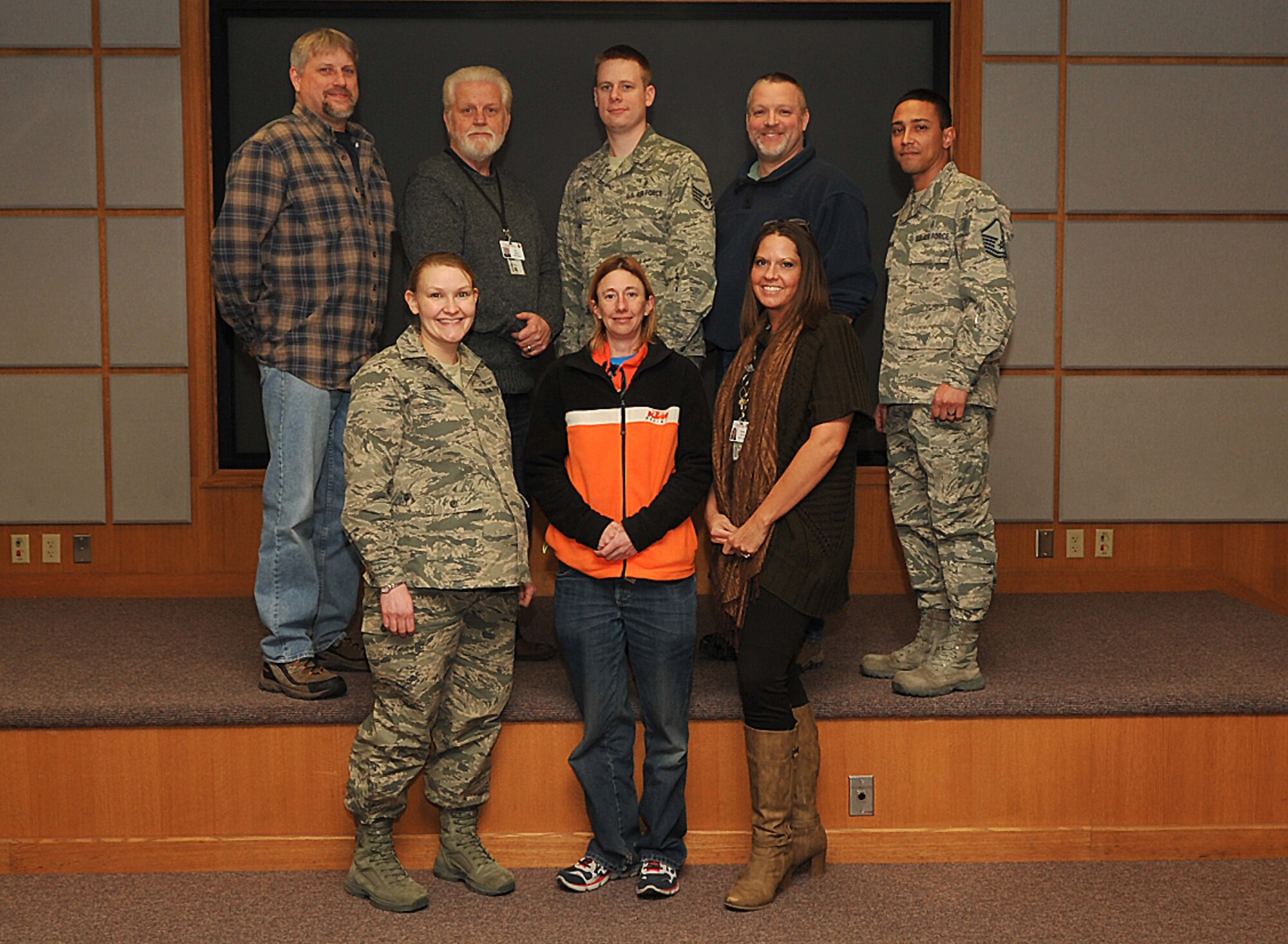 1st Lt. Jessica Swaim (far left, front row), 319th Medical Support Squadron resource management office and systems flight commander, poses with her flight for a group photo March 5, 2015, on Grand Forks Air Force Base, N.D. Swain was chosen as Warrior of the Week for the first week in March. (U.S. Air Force photo/Airman 1st Class Bonnie Grantham)