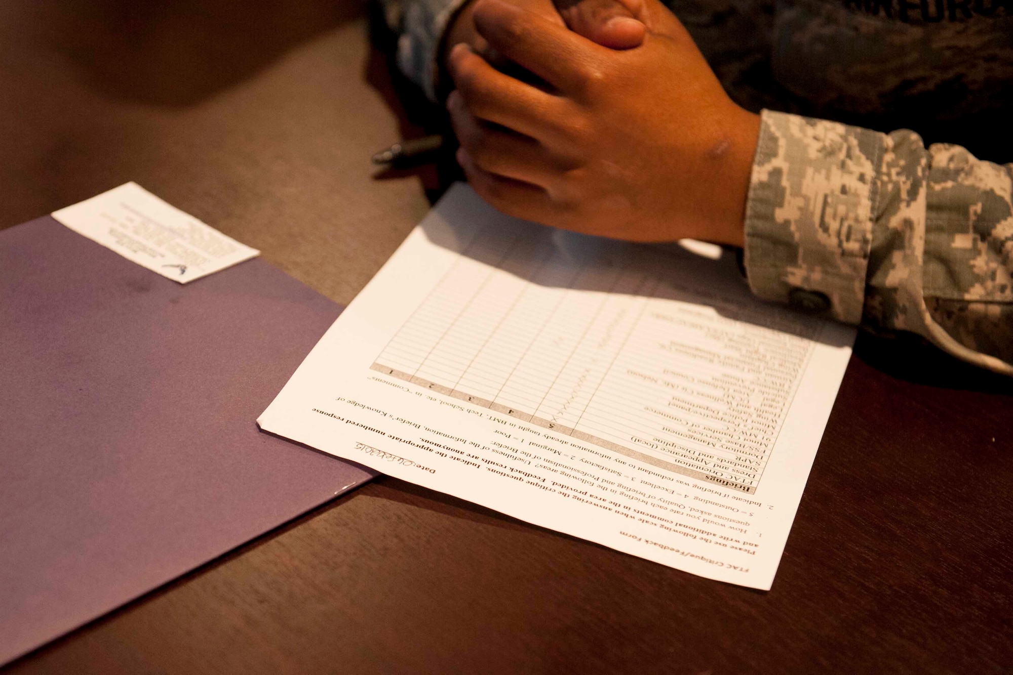 A student fills out a FTAC feedback form on Minot Air Force Base, N.D. Feb. 6, 2015. Pushing through approximately 700 Airmen a year, the first term Airman’s course was designed to help alleviate nervousness and guide Airmen through their transition from technical training to the operational Air Force. (U.S. Air Force photo/Airman 1st Class Sahara L. Fales)