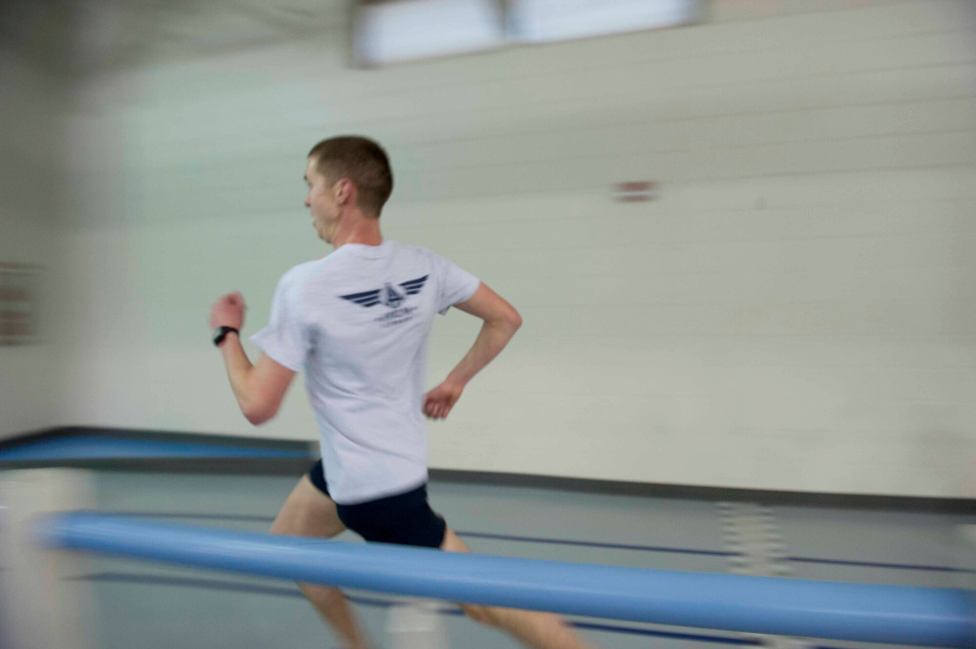 Airman 1st Class Augustin Sloan, personnelist from the 5th Force Support Squadron, sprints his last lap at the McAdoo Fitness Center on Minot Air Force Base, N.D. Feb. 11, 2015. Sloan makes time to run every day. (U.S. Air Force photo/Airman 1st Class Sahara L. Fales)